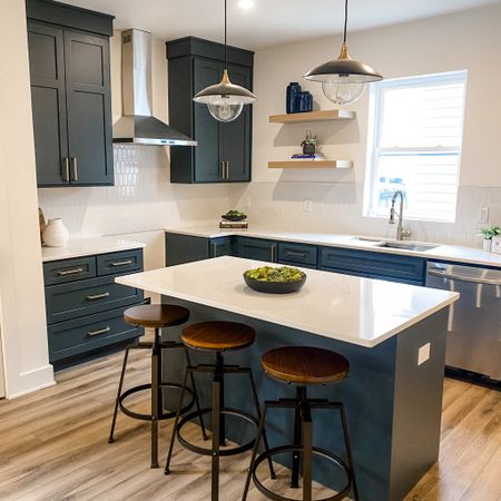 A gorgeous kitchen!! We incorporated creams, blacks, and wood tones in the space. And of course some greenery to add a pop of color.  

#LTKhome #LTKfamily #LTKstyletip