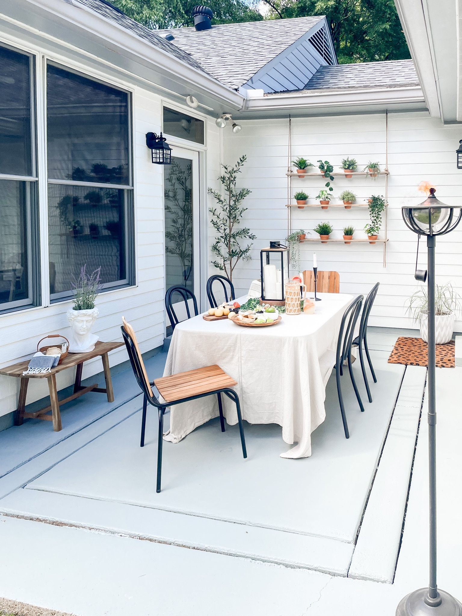 Outdoor patio dining
Outdoor table and cafe chairs
Tiki torches
Planter wall
Herb garden


#LTKfamily #LTKSeasonal #LTKhome