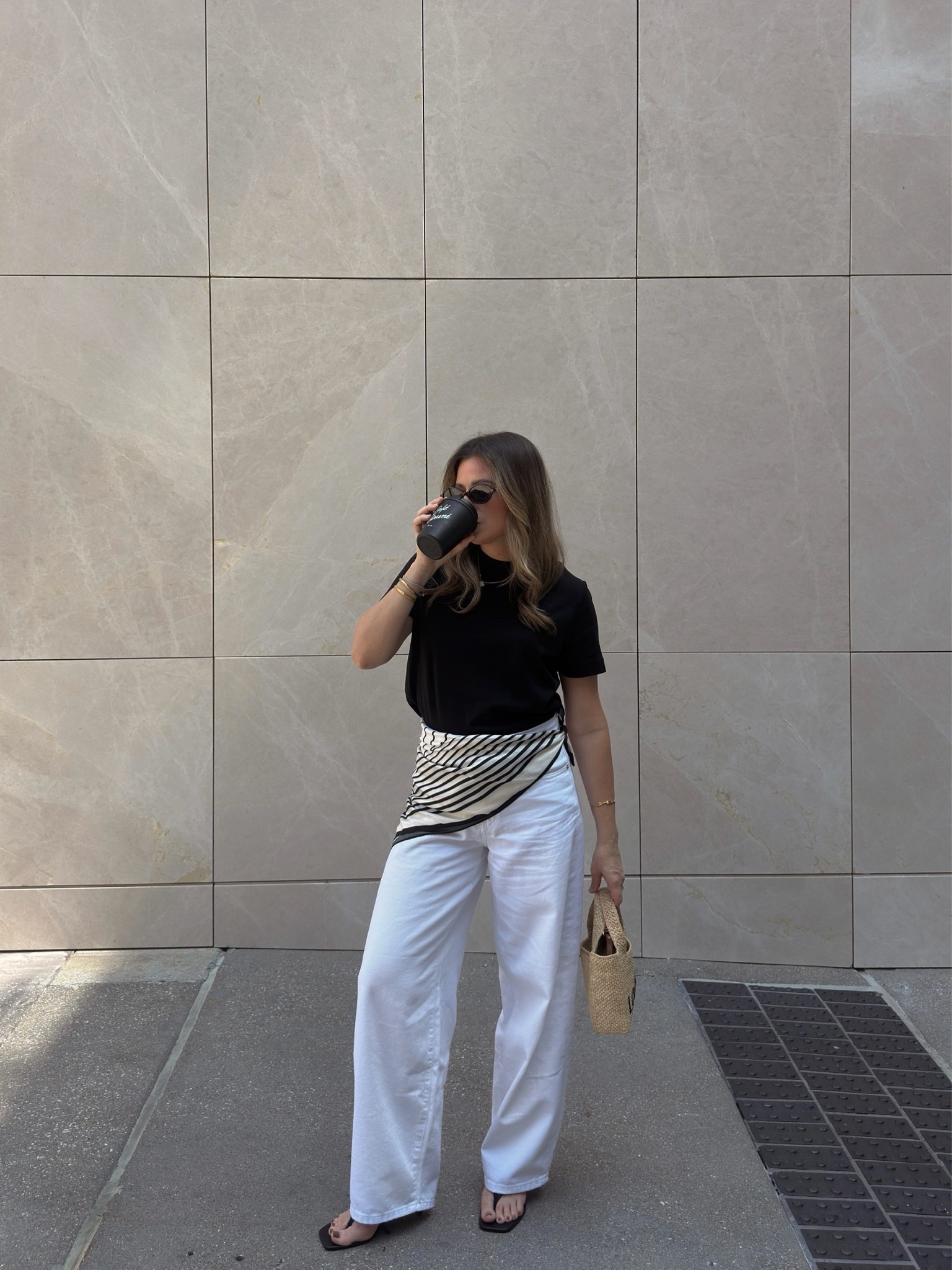 ✨ Summer neutrals I keep reaching for. This black tee and white wide-leg jeans combo is effortless, flattering, and easy to dress up or down. Added a striped scarf at the waist for a chic European-inspired touch. Linking my wide-leg white jeans, black crewneck tee, woven bag, sandals, and similar accessories. 🤍

#LTKPetite #LTKootd