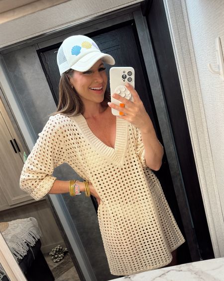 In a large deep v neck crochet coverup dress, medium 2 piece swimsuit, seashell hat and accessories for spring beach day - all fits TTS.

#LTKfindsunder50 #LTKswim #LTKstyletip