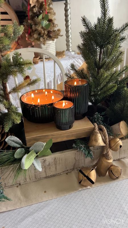 Christmas decor 
Candles and greenery 

On a 12 Timbers wooden stand and in a 12 Timbers dough bowl 
And bells

With greenery and trees

#LTKfindsunder50 #LTKHoliday #LTKVideo
