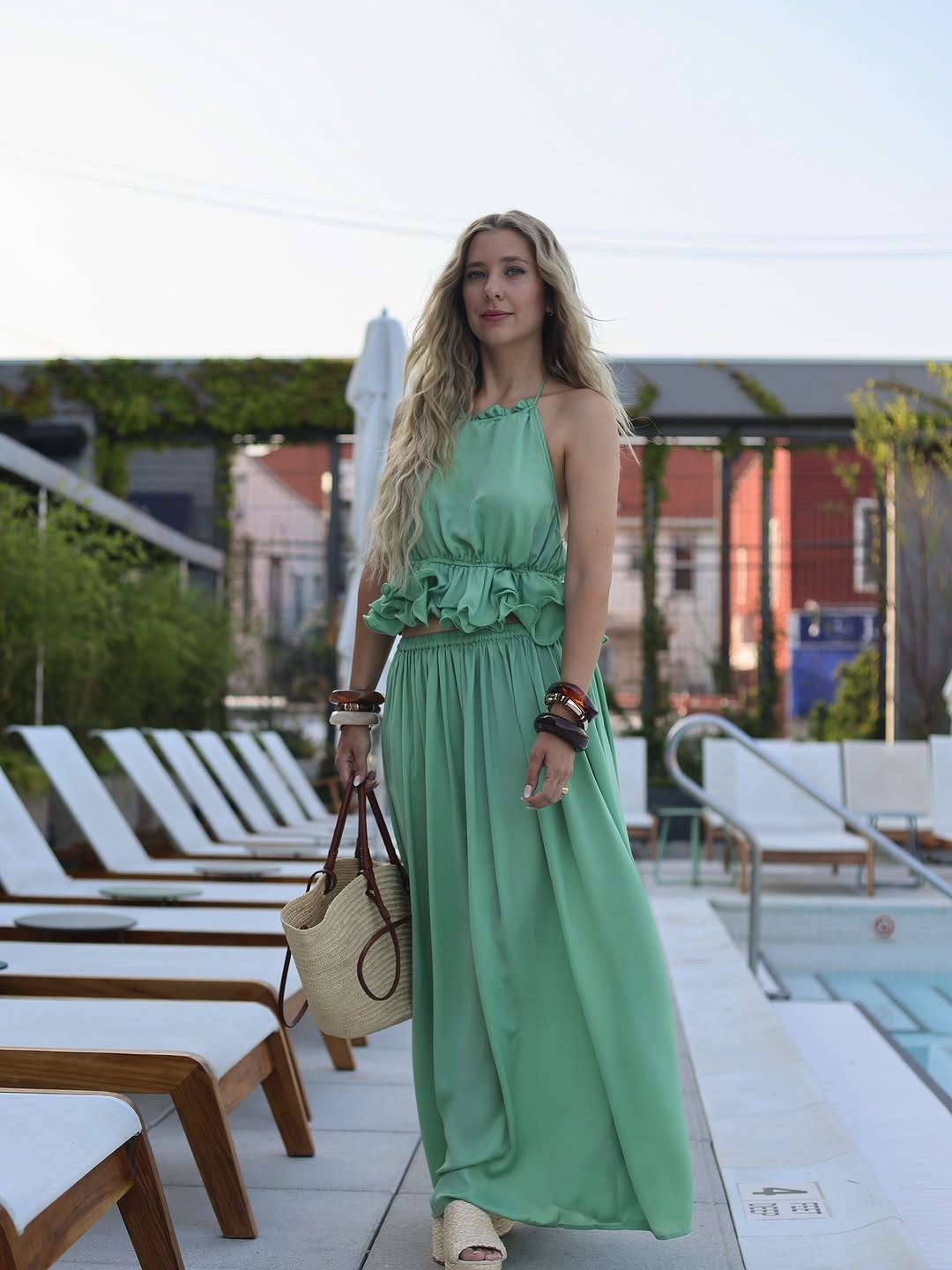 Poolside poise. This sage green ruffled halter top and matching flowing maxi skirt create a dream vacation silhouette, perfectly paired with a straw tote. #SummerMaxi #SageGreen #LTKtravel 

 #LTKdayinmylife #LTKgrwm #LTKootd