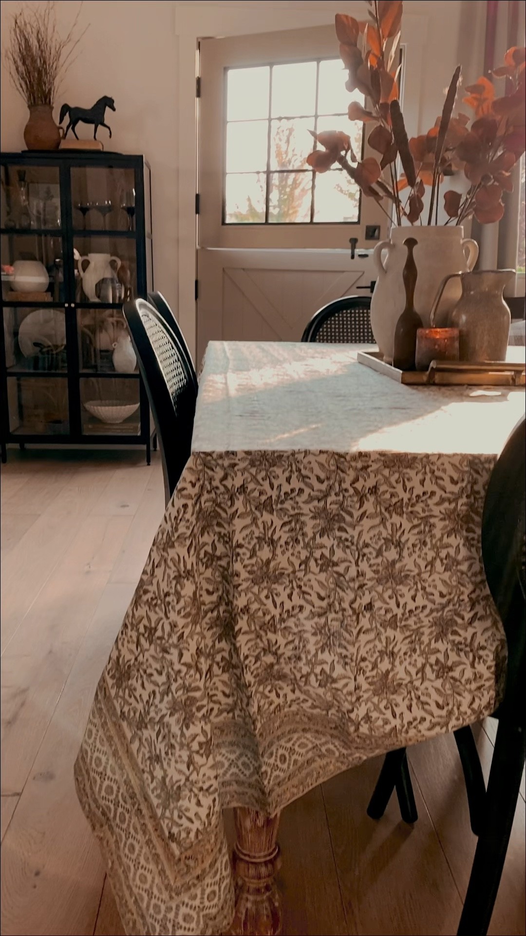 Fall morning views | cane dining chairs, block print table cloth, black cabinet, marble side table, linen accent chair, chandelier 

#LTKhome #LTKHoliday #LTKSeasonal