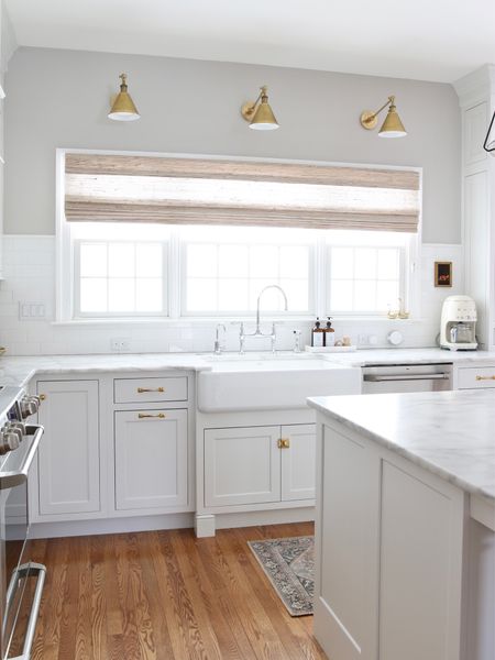 I love the views of our backyard from these windows. Especially in the evening when the sun sets. I switched to brass tones lights and hardware to warm up my all white kitchen. The sconces are from McGee and Co. all of the hardware is Rejuvenation 

#LTKstyletip #LTKhome #LTKFind