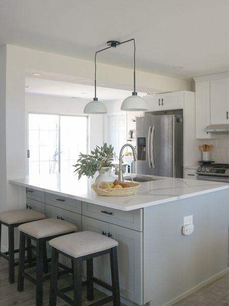 My clients asked for a scan so-traditional kitchen design and this 2-light sculptural fixture was the perfect match for over their island. It’s currently on sale!

#LTKstyletip #LTKhome #LTKsalealert