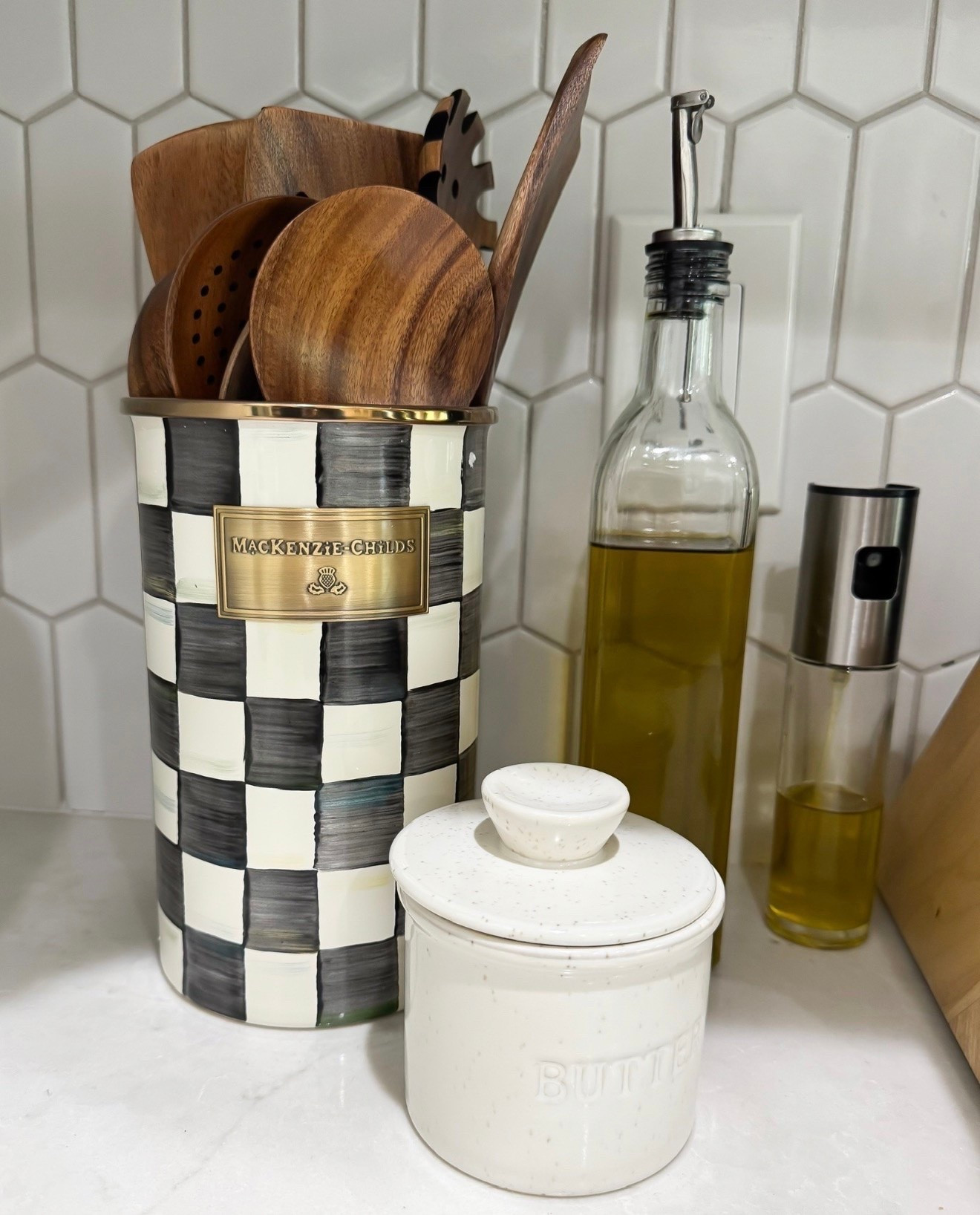 Little kitchen details that make your counters feel extra cute and styled. Love mixing functional pieces with decor, and this utensil holder is one of my favorites.

kitchen decor, mackenzie childs, countertop styling, kitchen organization, utensil holder, neutral kitchen decor, home decor finds, cozy kitchen aesthetic, everyday home essentials, kitchen accessories, cottage style decor, black and white decor, home styling inspiration, lovelylifestyling