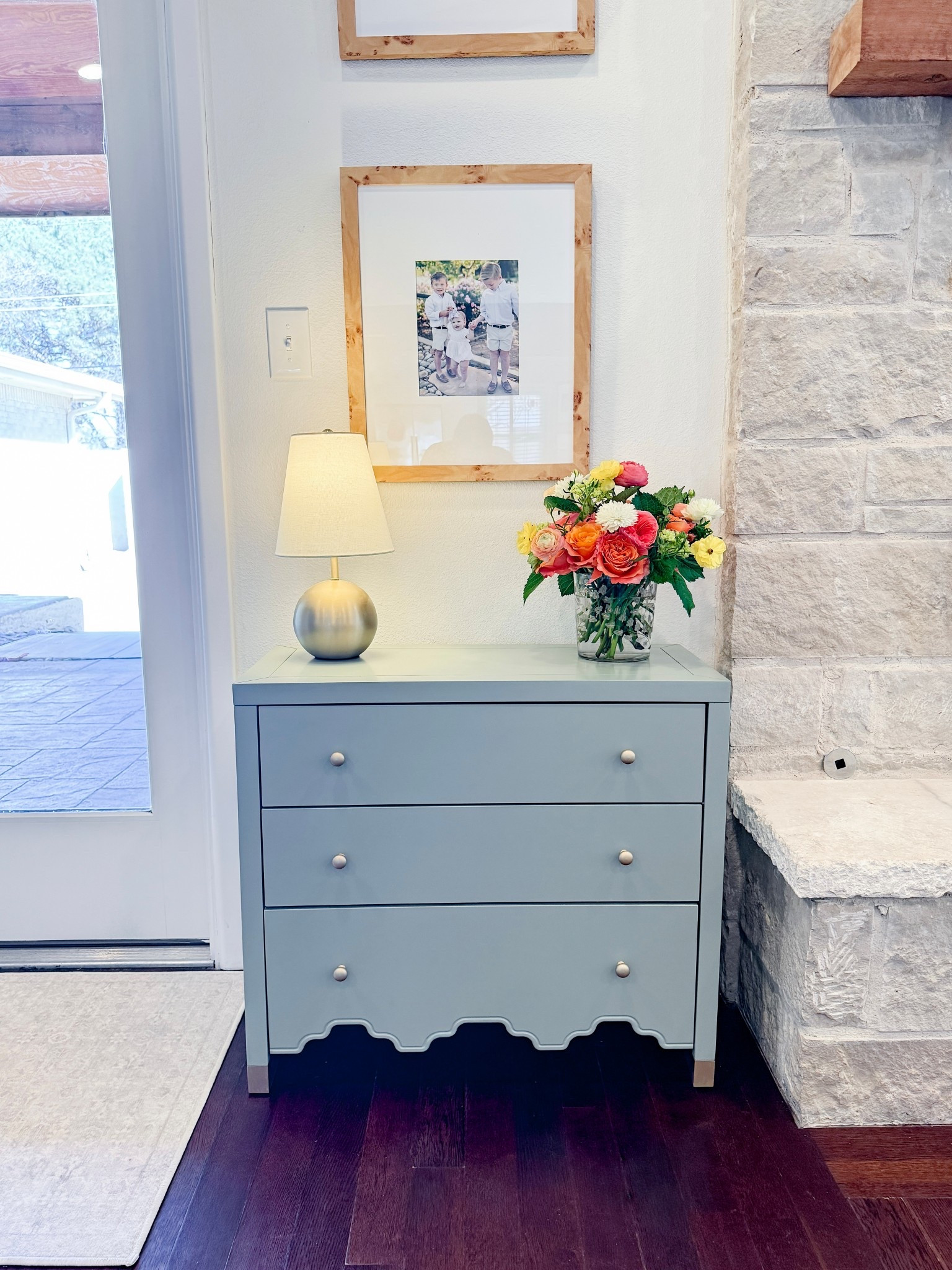 @TJ Maxx for the win again!

This soft green chest might be one of my favorite finds lately. The scalloped detail along the bottom gives it that custom, grandmillennial feel, and the gold-capped feet elevate it so much.

It fits perfectly in this little nook by the fireplace and instantly warmed up the space. Styled it with a simple lamp, fresh flowers, and one of my favorite photos of the kids and it completely finished the corner. Proof you don’t have to spend a fortune to get that polished look!

#LTKHome #LTKmomlife #LTKSaleAlert