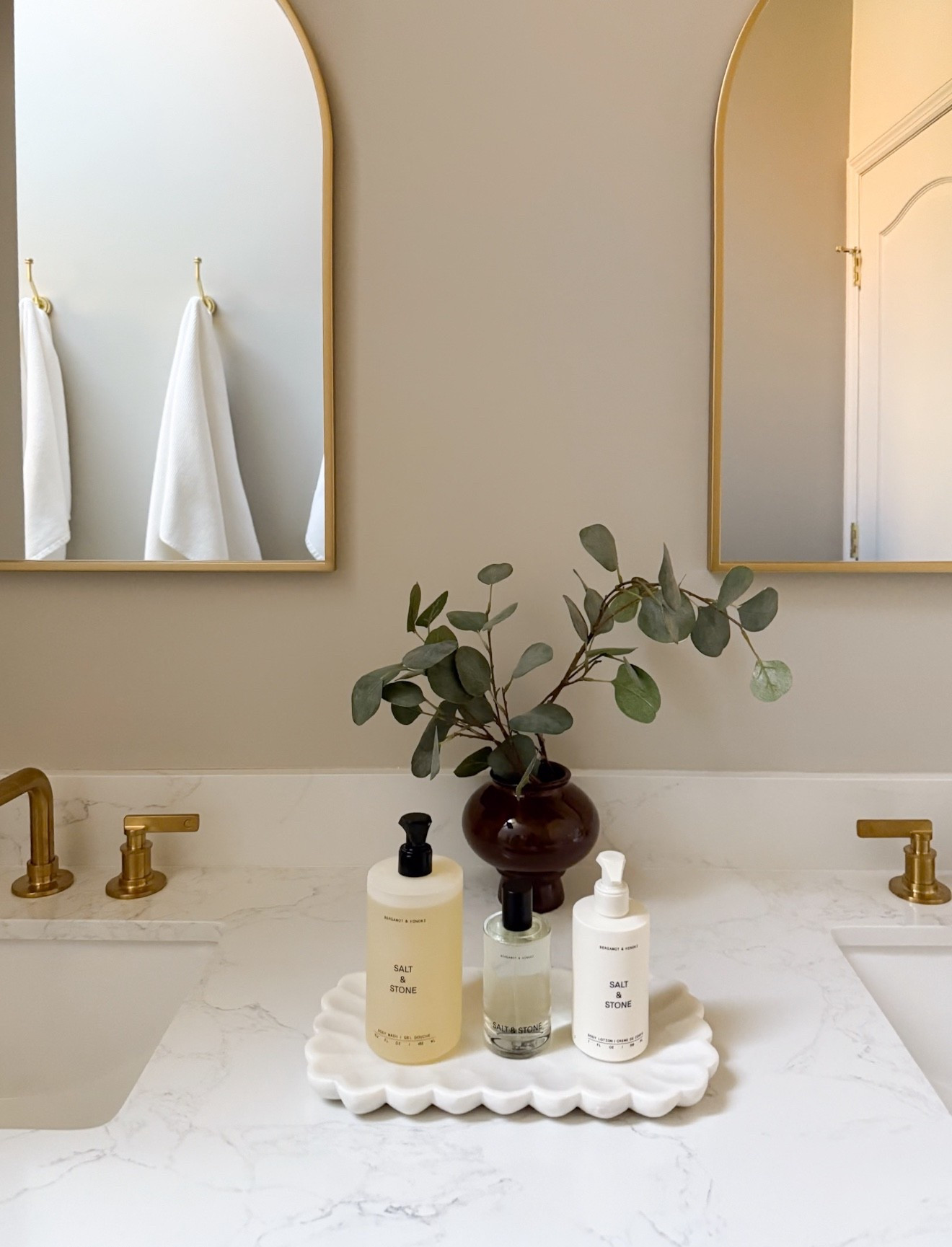 Styling a bathroom vanity! I love to use a tray to corral soap and lotion, add a candle, and also a small vase with flowers or seasonal branches if you have the space. Linking favorites! 

#LTKFindsUnder100 #LTKSeasonal #LTKHome