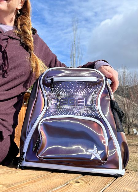 Ready for my hike with my @rebelathletic sparkly backpack! The best backpack in the world! It has tons of compartments in so many fun and gorgeous colors!  It’s a stunning, spacious, high-tech, super lightweight, built to last Dream Bag!

It has adjustable padded shoulder straps with load lifters. A 4-way adjustable sternum strap and compression straps to balance the load! I love that it stands up on its own, empty or full. 

Some bags have a luggage sleeve which allows to attach to any rolling luggage. The interior padded laptop sleeve has a velcro strap. Mesh storage pouch in main compartment. Disappearing headphone zip pouch at the top of the bag. I love the expandable shoe compartment with a mesh panel for breathability! Adjustable mesh side pocket for water bottles of all sizes and so much more!

I’ll definitely be using this the next time I travel! ✈️ 


#LTKtravel #LTKitbag #LTKfitness