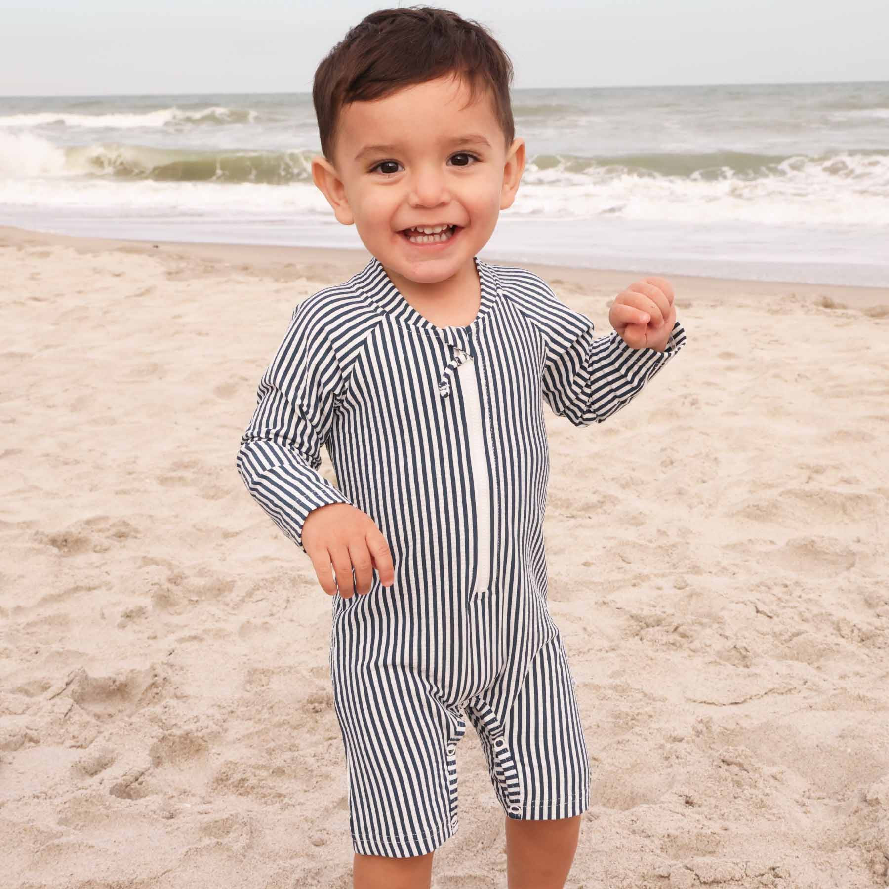 Long Sleeve Rash Guard Swim Romper Shortie | Seersucker Navy | Caden Lane