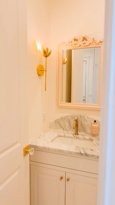 Powder bath | light fixture | sconce |  gold | mirror | pink mirror | butterfly | hardware | towel holder | flower sconce | Caitlin Wilson | bows | 