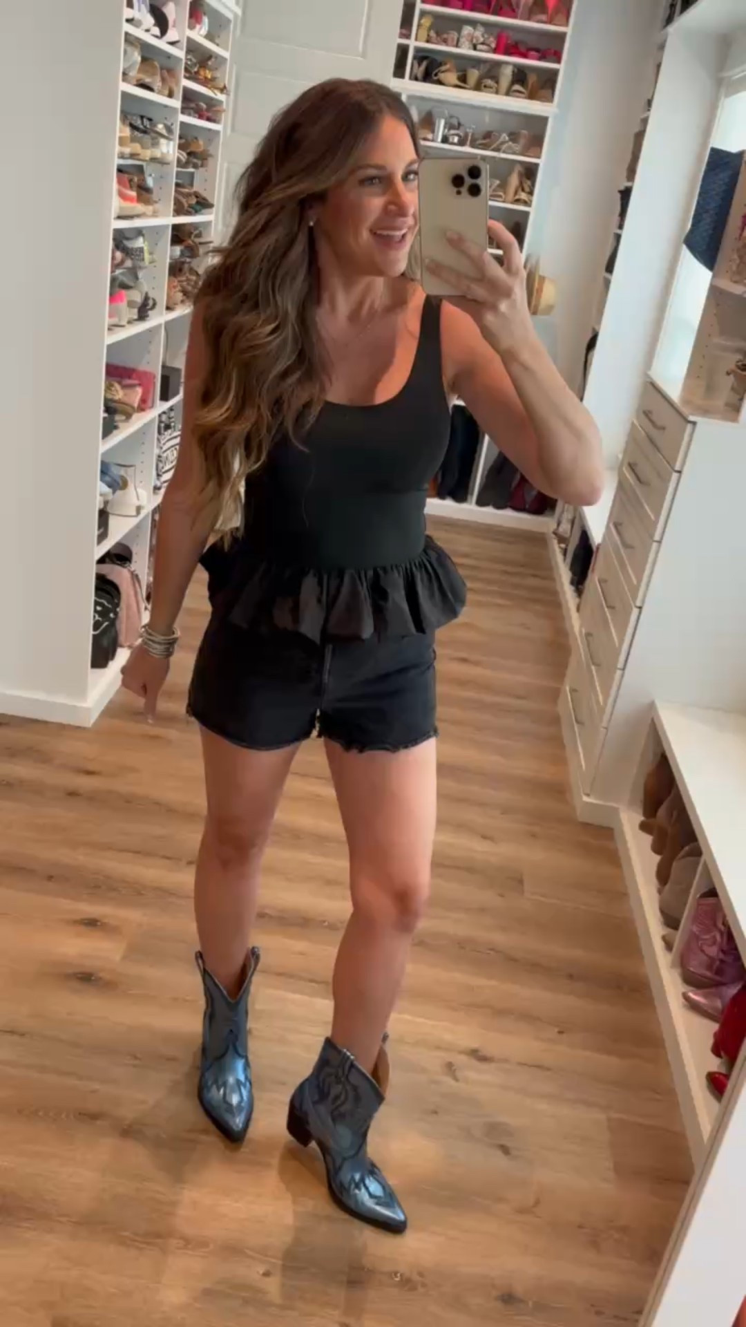 In a small peplum bubble hem tank, black denim shorts, metallic ankle cowboy boots and accessories- all fits tts.

#LTKStyleTip #LTKFindsUnder50 #LTKSeasonal