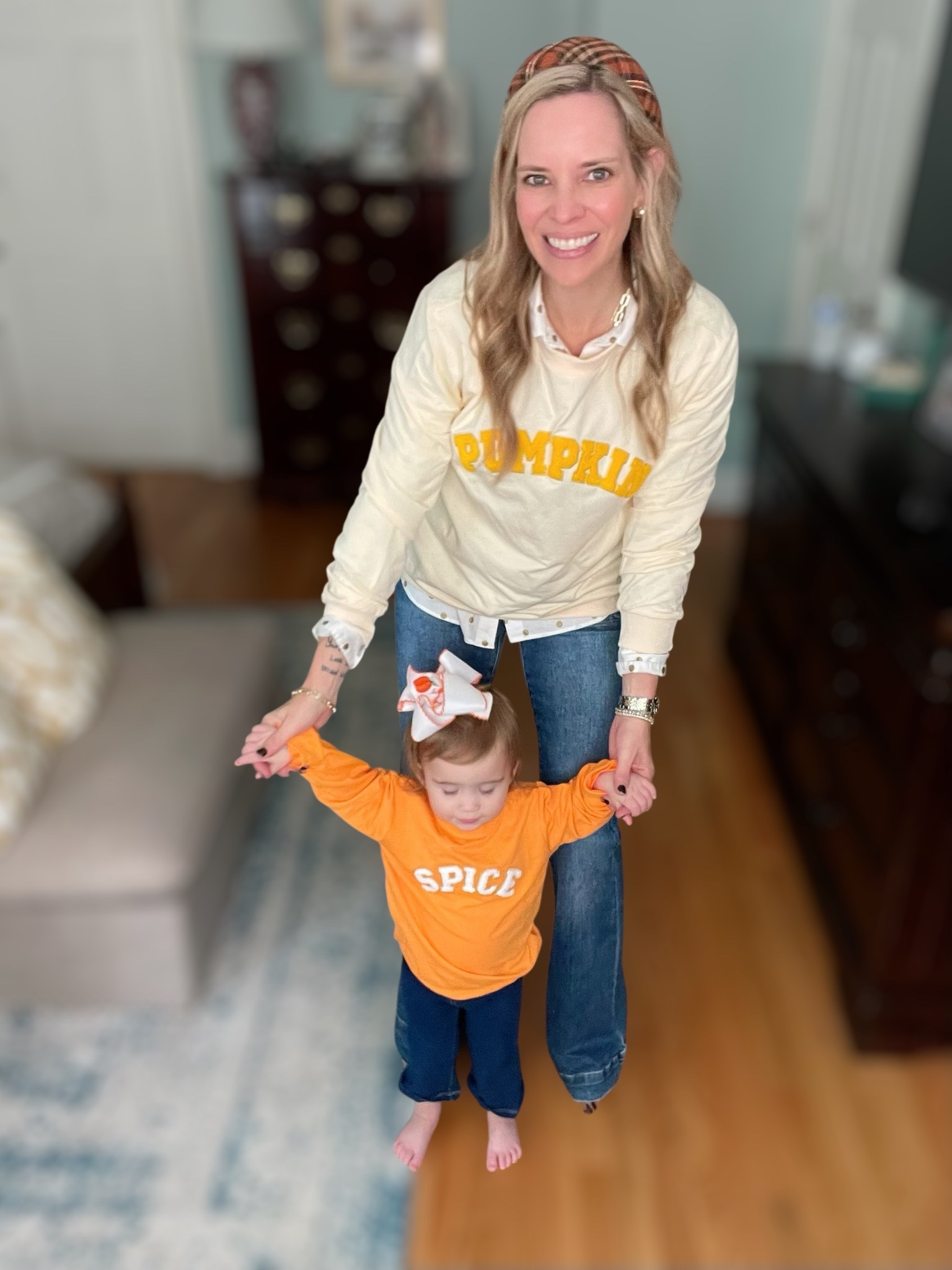 🍂 Nothing says fall like a little Pumpkin Spice! Caroline and I are twinning in these adorable Mommy & Me graphic sweatshirts—mine says Pumpkin and hers says Spice. Perfect for cozy fall days, pumpkin patches, or casual family outings. 💛

I layered my Pumpkin sweatshirt over a crisp white button-down with jeans (wearing size 0) and styled with a plaid headband, leopard pumps, and my everyday Melinda Maria jewelry stack (tennis bracelets + Lil Frankie necklace). Caroline is rocking her Spice top with little flare jeggings and the cutest pumpkin hair bow. 🎃

This look is cozy, playful, and festive—ideal for fall family photos, pumpkin patch outfits, or a fun Mommy & Me matching moment. Bonus: everything is super affordable and easy to wear all season!

⸻


Mommy and Me fall outfits 🍂 | Pumpkin Spice graphic sweatshirts | family fall photos outfit ideas | pumpkin patch style | Mommy and Me matching sweatshirts | toddler fall outfit inspo | plaid headband fall style | leopard print shoes outfit | fall jewelry stack | cozy casual fall fashion


#LTKKids #LTKFamily #LTKBaby