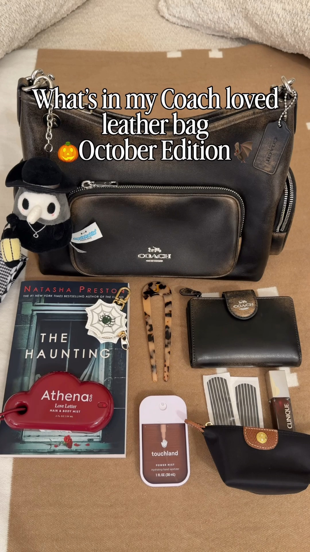 Happy October 🍂 Comment SHOP & I’ll dm you the links ♥️

What’s in my bag:
Coach outlet loved leather pocket Laurel
Spooky book
Black and white bandaids
Clinique black honey lip gloss 
Fall touchland hand sanitizer
Athena body and hair most charm
French hair pin from Amazon
Black claw clip 
Black nylon pouch
Loved leather wallet 
Burga magnetic phone charge bank 
Mini spider web AirTag to jewelry holding charm
Palm pals bay plush bag charm