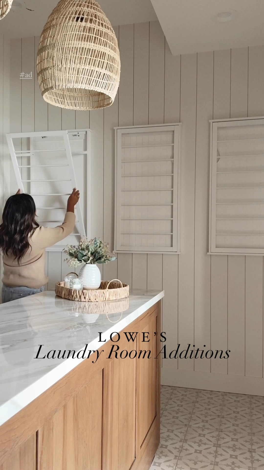 #ad I had these wall-mounted drying racks in my previous house, and when we were building this house, I knew I wanted the same ones in the new laundry room.  I got these from @loweshomeimprovement , and I also added some new decor in here like the lamp, eucalyptus plant, tray, wooden vases, and rug! #LowesPartner

#LTKStyleTip #LTKVideo #LTKHome