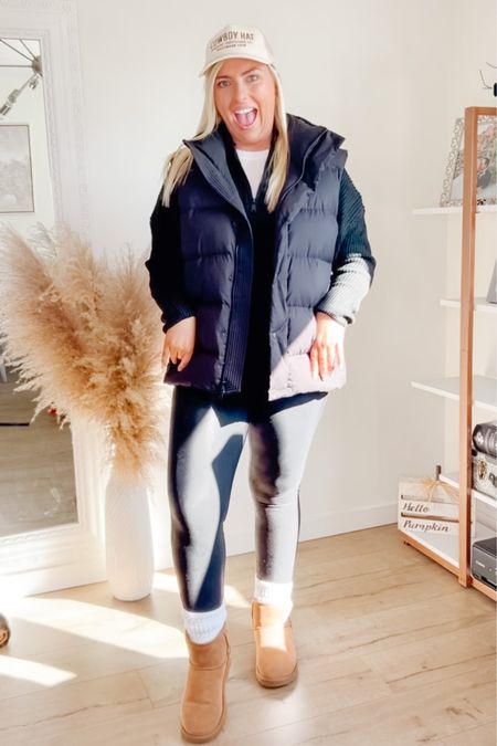 Cozy fall outfit. 
Midsize style. 
All black outfit. 
Spanx leather leggings. 
Lululemon vest. 
Amazon sweater. 
Midsize Amazon fashion. 
Trucker hat. 
Uggs  

#LTKfindsunder50 #LTKSeasonal #LTKmidsize