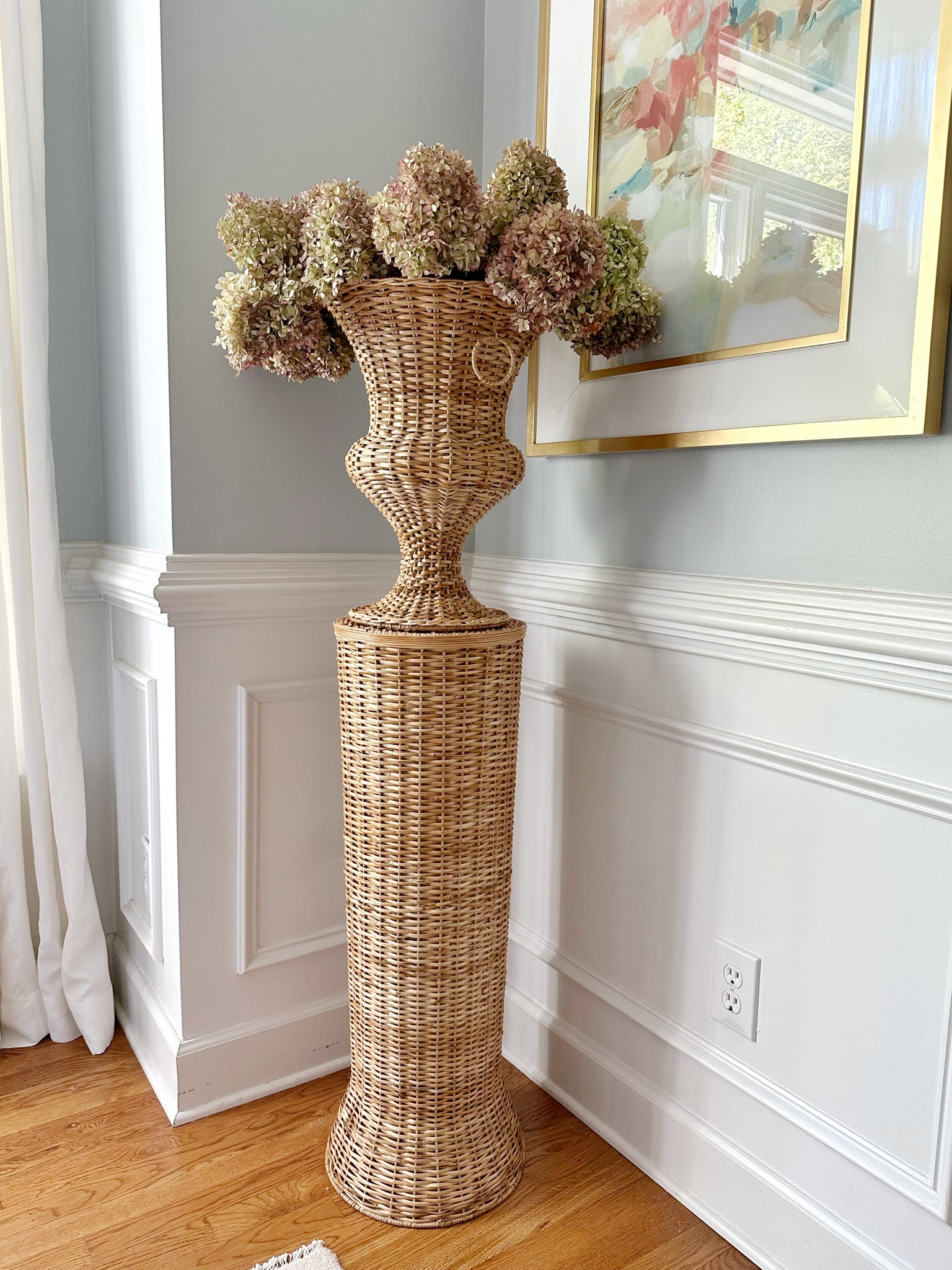 Wicker pedestal and urn, the well appointed house, abstract wall art, dining room, oushak, area rug, chandelier 

#LTKFind #LTKhome