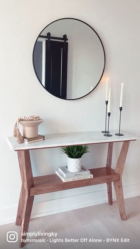 Console table styling with a mirror, candle sticks, books, and more  

#LTKhome