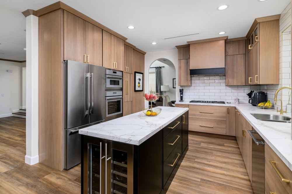 Designed, remodeled, and custom-built by our team—this kitchen brings warmth, contrast, and modern elegance into perfect harmony. We supplied the white oak cabinetry, featuring clean slab doors and bold brass hardware, paired with a matte black island and coordinating wine fridge for added function and flair. The Dekton countertops, full-height pantry wall, and flush installed appliances are just a few of the details that make this remodel both beautiful and built for real life.

From first sketch to final install, this kitchen is the perfect blend of style and performance.

#KitchenRemodel #CustomCabinetry #WhiteOakKitchen #BlackKitchenIsland #DesignBuildFirm #QuartzCountertops #ModernKitchenInspo #SlabCabinets #LTKHome #PinterestKitchen #WineFridgeIsland #BrassHardware #FullHeightCabinets #KitchenDesignGoals #InteriorDesignAndBuild #TimelessKitchenStyle 

 #LTKHome