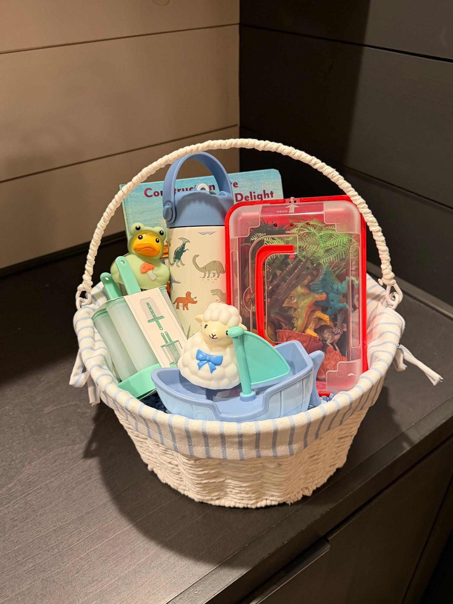 JJ’s Easter basket! He is 15 months old for reference. Super into construction vehicles & dinosaurs. The dollar section items were not linkable - I got popsicle molds, two rubber ducks, and a boat. I hope this helps 🫶🏼💛 

#LTKSeasonal #LTKBaby #LTKKids