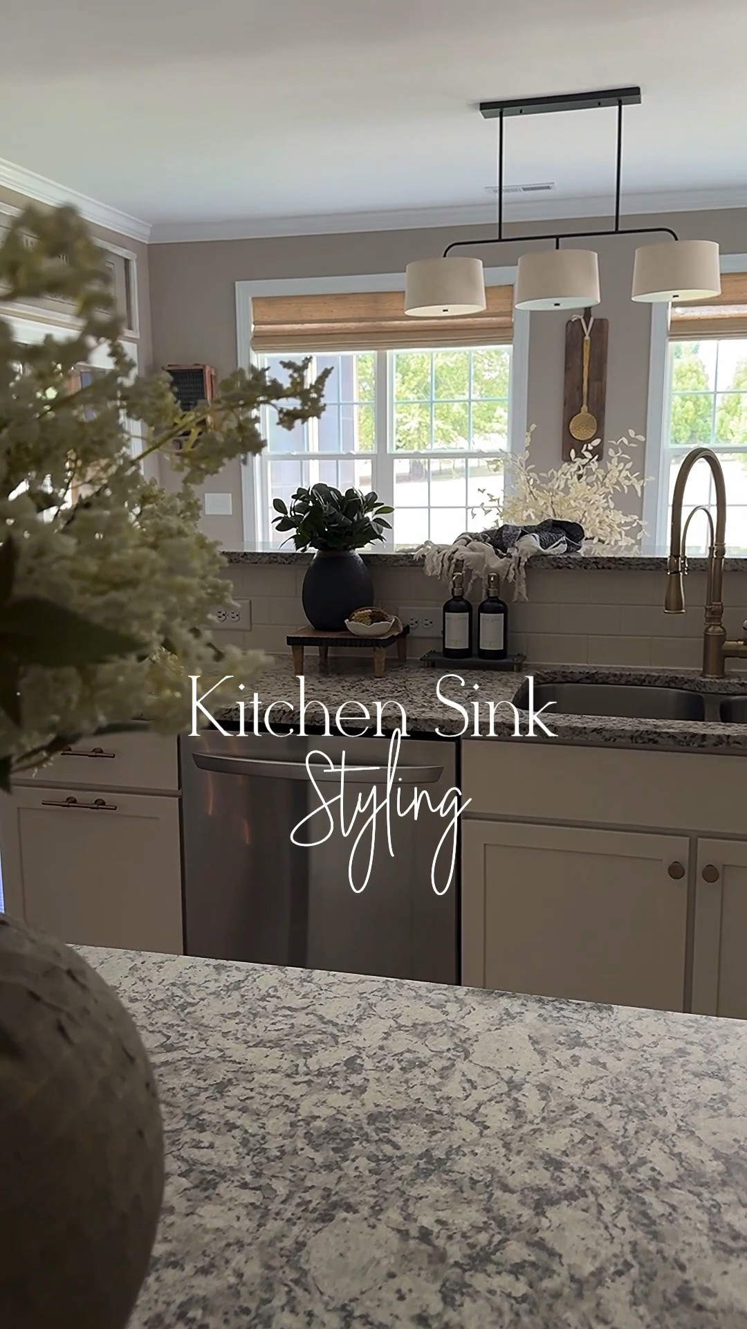 Kitchen Sink Styling

I am so impressed with this water absorbing stone tray. No more messy bottles!!

Drying tray, dispenser bottles, vegetable scrub brush, faux white berry stems, taupe vase, gold kitchen faucet, Turkish towels, greenery, riser, white bowl, linear chandelier

#LTKHome #LTKstorytime #LTKSeasonal