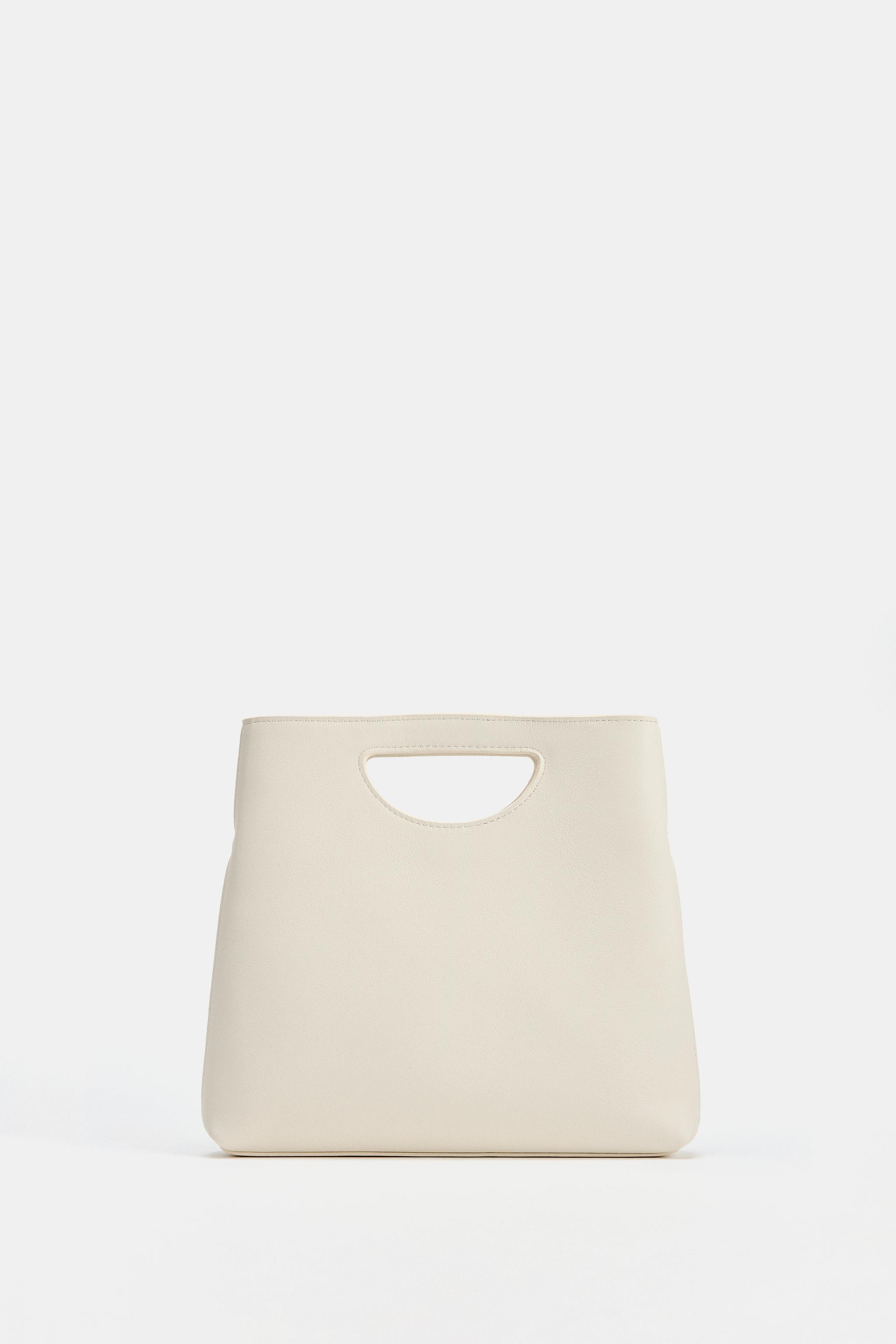 Leather handbag. Asymmetric design. Top handle with side cut-out detail and removable crossbody s... | Zara UK