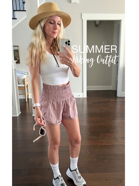 My favorite summer outfit for hiking. Top is very supportive with built in bra and cute back straps (I have this in multiple colors). Shoes are trail runners from on cloud. Shorts are comfy and airy, perfect for sticky weather and come in a wide variety of colors. This watch band is resin and goes with everything. I like wide brimmed hats to protect my skin from the rays. 

#LTKSeasonal #LTKfit #LTKstyletip