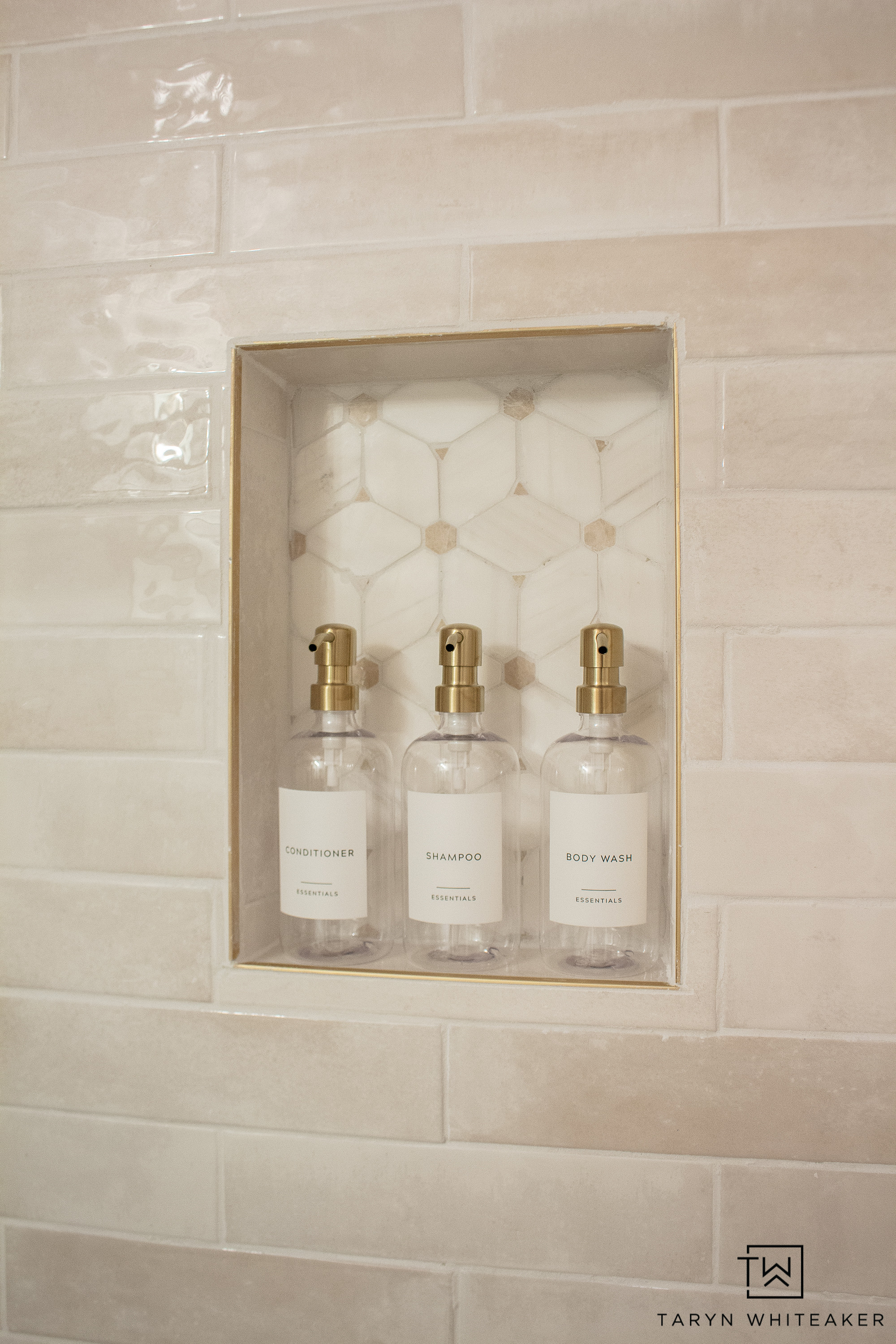 A simple shower upgrade that makes the whole space feel more elevated. Matching refillable bottles keep everything looking clean and streamlined, and the gold pumps tie in beautifully with the warm tones of the tile. It is such an easy way to bring order and style to your bathroom without a full renovation.
Linking the bottles, labels, and similar bathroom organization pieces to help you recreate this minimal, polished look.

#LTKSeasonal #LTKHome #LTKgrwm