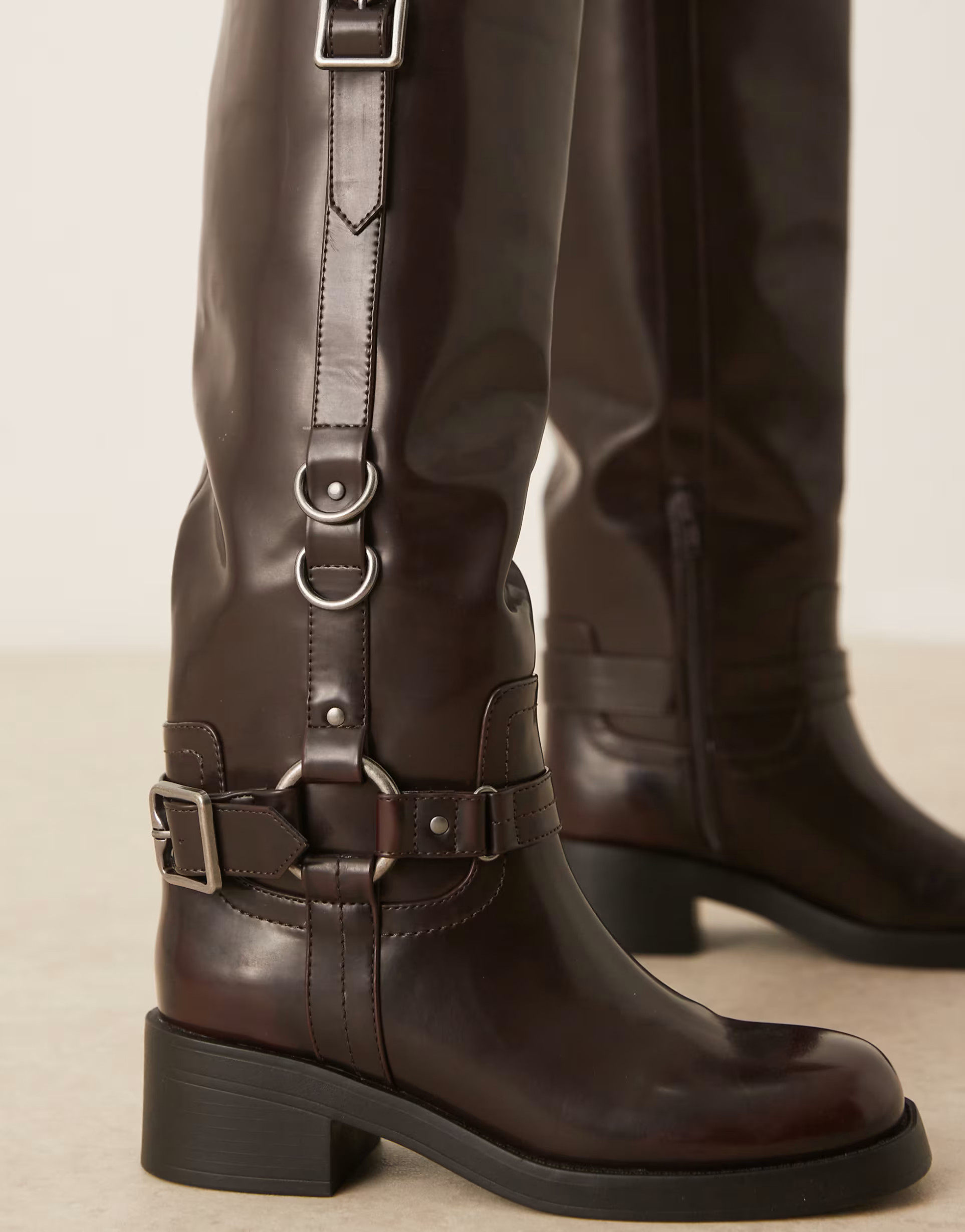 ASOS DESIGN Cobra buckle harness knee boots with silver hardware in burgundy | ASOS (Global)