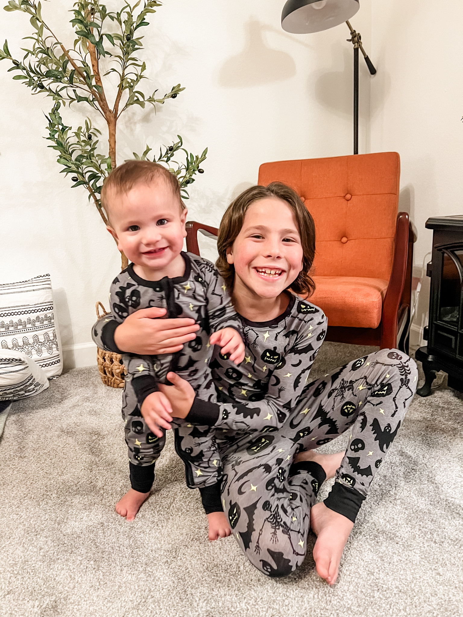 Spooky little boys in their super soft Halloween pjs! We are obsessed and they are glow in the dark!!!! So much fun! Also linked this cute chair, super affordable olive tree, lamp, and our comforter set! 

#LTKHalloween #LTKKids #LTKSeasonal