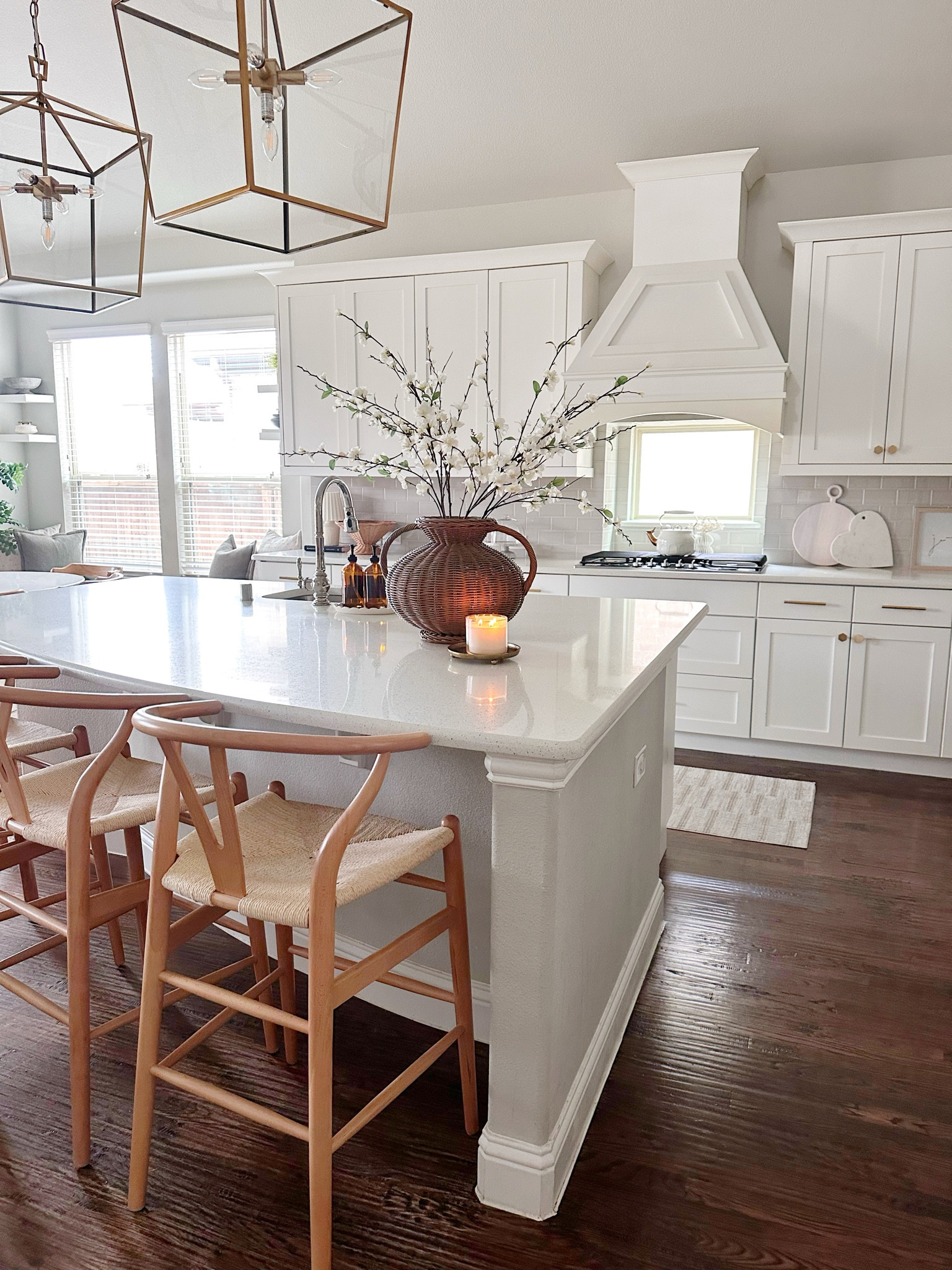 Quiet mornings in the heart of our home. Loving how the woven details on our barstools and vase bring so much warmth to our white kitchen. 🤎

#LTKStyleTip #LTKHome #LTKSeasonal