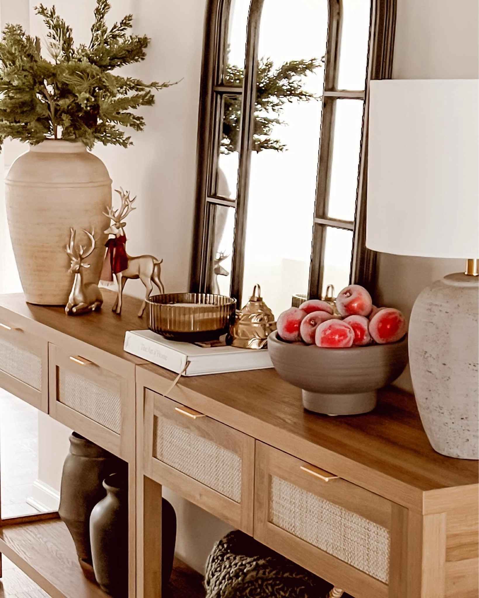 ‘Tis the season to add a festive touch to our homes and what better way to do it than with a simple touch of chiffon ribbon? 🎀 Whether it’s your console table, Christmas tree, or any corner that needs a festive boost, this easy trick can instantly elevate your decor game! 

Just take a length of beautiful chiffon ribbon in your favorite holiday color, and let your creativity shine. 

I love tying bows and placing them all around my Christmas tree for an elegant finishing touch. Or just like I did here, tie it around your console table decor for a pop of color. The soft, flowing texture of chiffon adds a touch of whimsy and it looks high-end and gorgeous! 
.
.
.
.
.

#ConsoleTableDecor
#ChristmasTime
#ChristmasDecor
#HolidayDecor
#HomeDecor
#InteriorDesign

#LTKCyberWeek #LTKHoliday #LTKhome