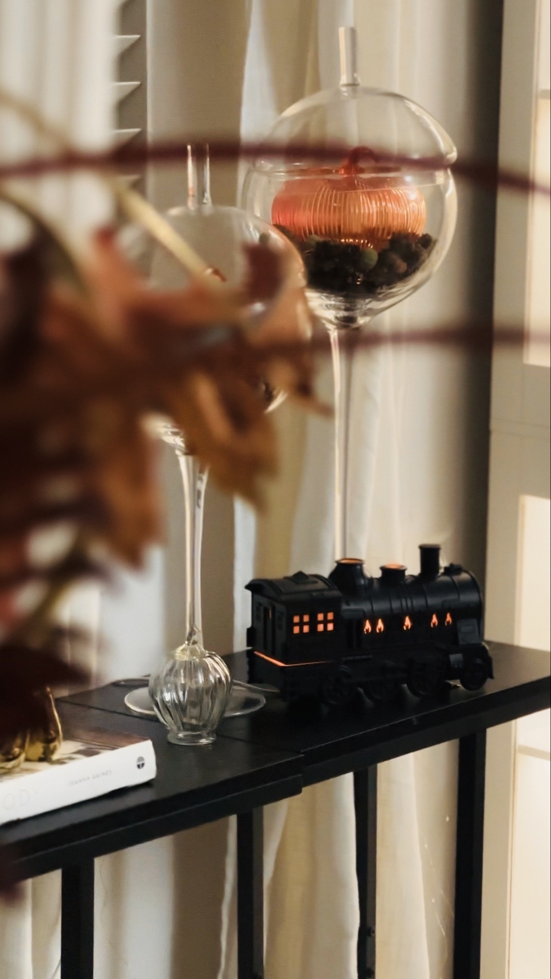 Fall whispers in every corner 🍂✨
Styled my black console table with glass cloches, glowing pumpkins, and my favorite little black train all lit up for the season. Cozy, classic, and just a touch whimsical.

#LTKSeasonal #LTKHome #LTKvlog
