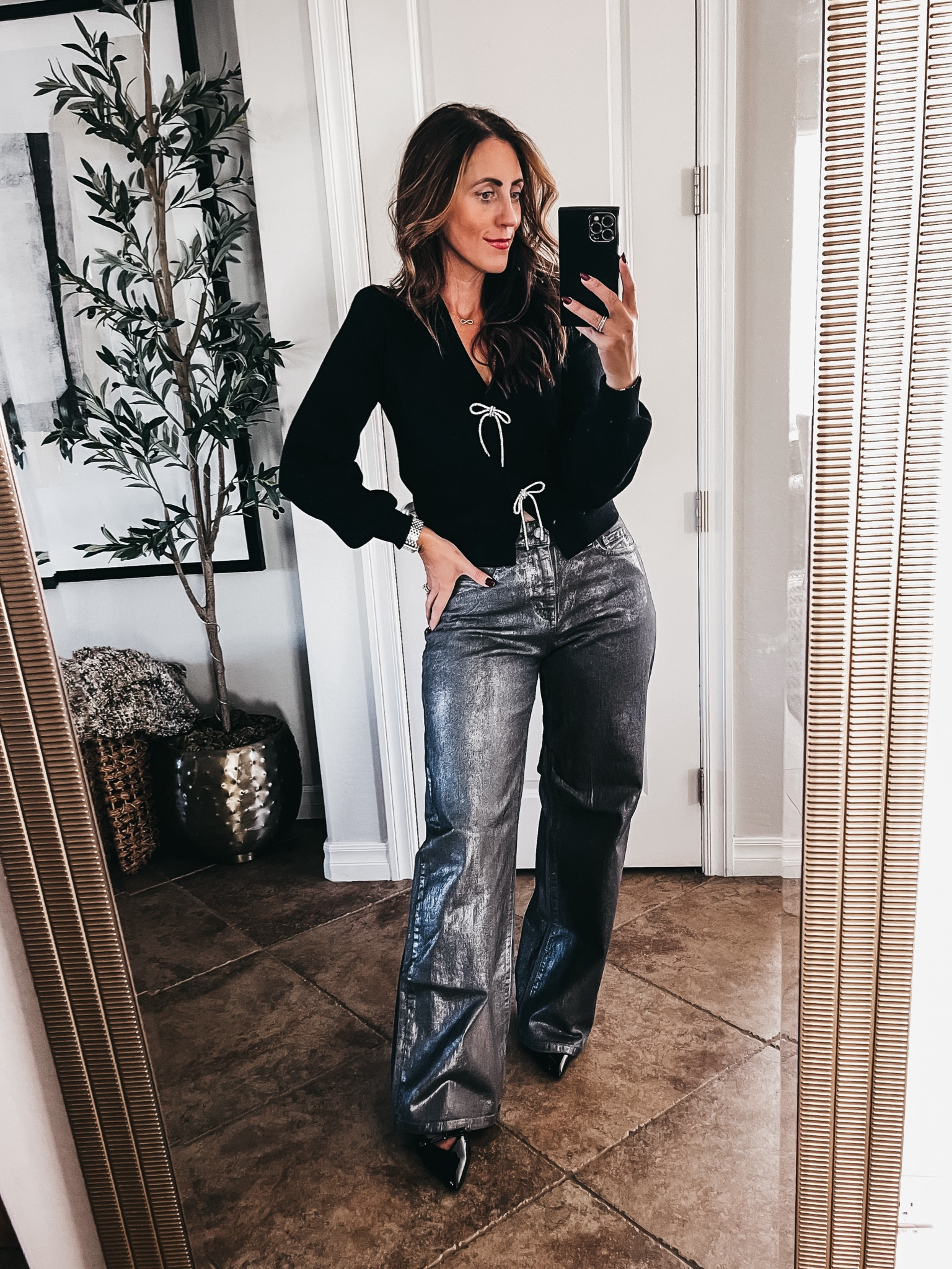 Holiday outfit idea! 🖤🪩// Crystal bow sweater cardigan with wide leg metallic jeans! 

- Sweater - size small 
- jeans - size 4 (run long, 31.5” inseam)
- patent leather bow kitten heels - size 8 (size up if in between)

Holiday style, holiday party outfit idea, holiday workwear, holiday sweater, festive sweater, bow sweater

#LTKStyleTip #LTKHoliday #LTKFindsUnder50