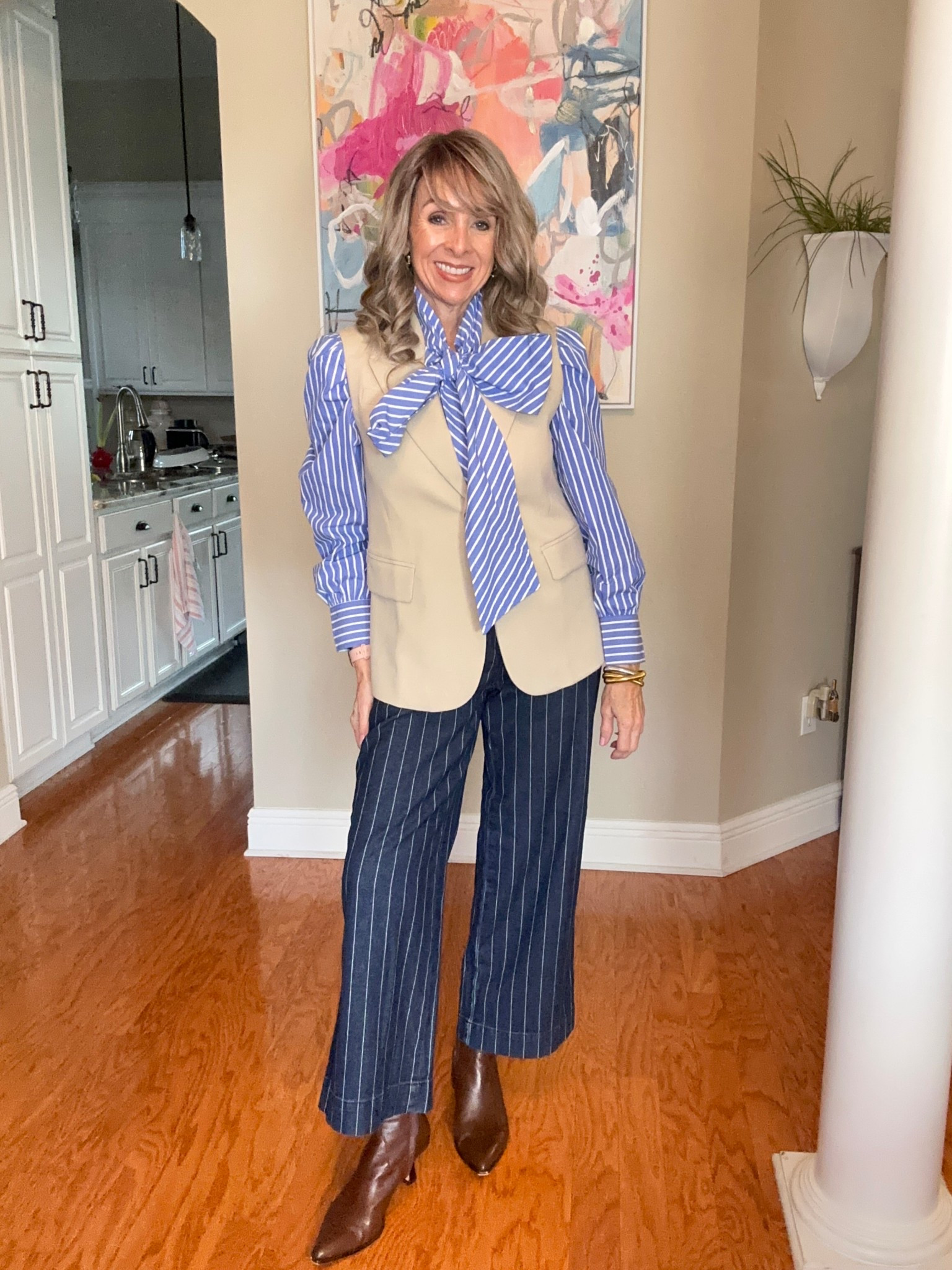 Classic with a twist 🤍
This is one of those outfits that instantly makes you feel pulled together. A crisp striped blouse with a statement bow layered under a tailored vest = effortless polish. Paired with pinstripe trousers and sleek ankle boots for a timeless, flattering look that works for everyday or meetings.

Neutral, tailored, and elevated—this is a money outfit you’ll wear on repeat.
👉 Shop every piece linked here.

#LTKOver40 #LTKSaleAlert #LTKFindsUnder50