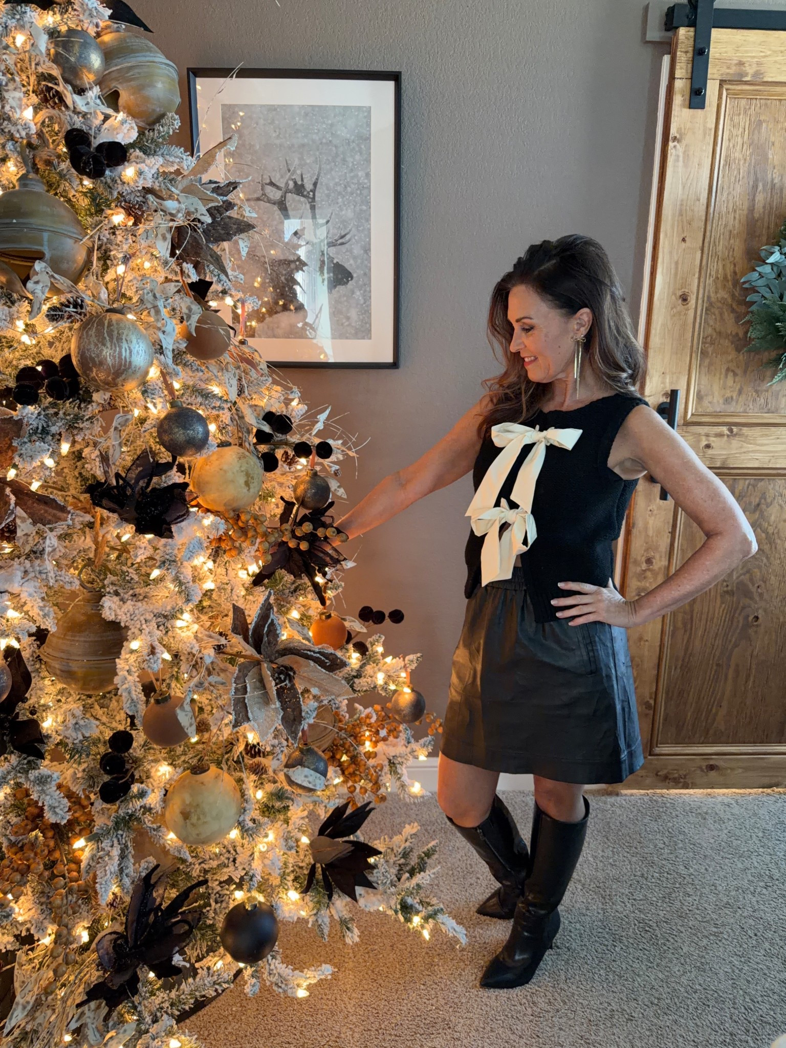 Festive on trend holiday party outfit inspo- black leather skirt, bow sweater, bow earrings 

#LTKHoliday #LTKOver40 #LTKSeasonal