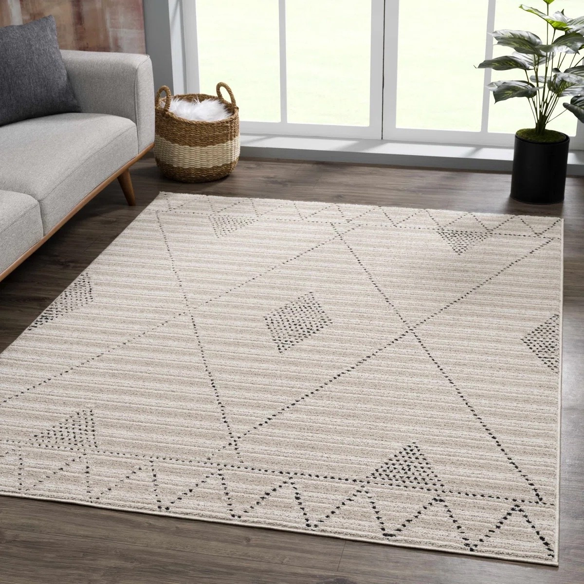 Refresh your space with this neutral geometric area rug from Wayfair. Featuring a soft beige and gray color palette with subtle geometric patterns, this rug adds texture and warmth without overwhelming your decor. Perfect for living rooms, bedrooms, home offices, and modern farmhouse spaces, it’s an easy way to create a cozy, layered look that works year-round.