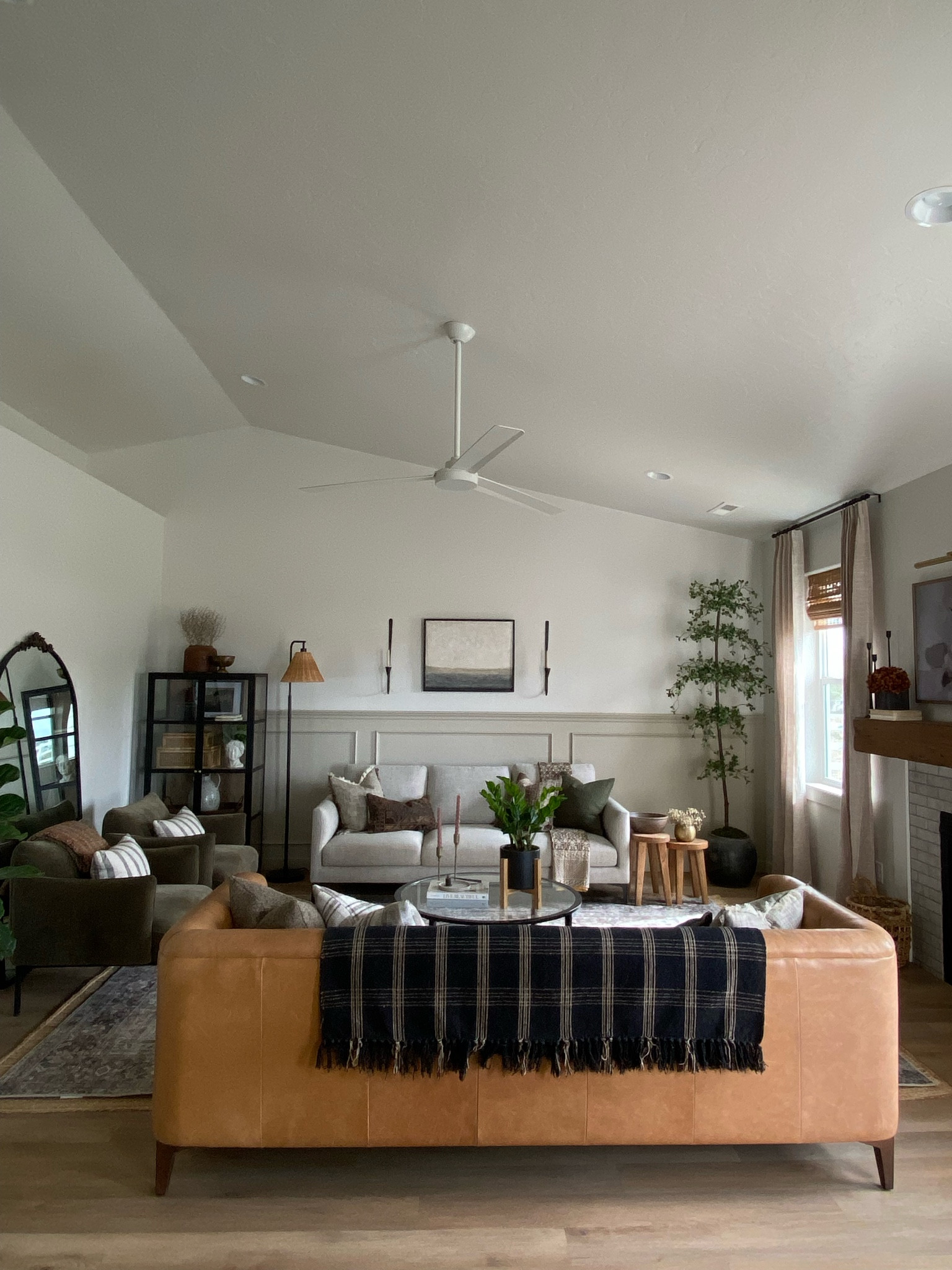 Living room inspo, custom curtains, pinch pleat curtains, floor to ceiling curtains, neutral sofa, beige sofa, west elm penn chair, green accent chair, vintage pillows, Turkish pillows, boucle pillow, shady lady tree, faux tree, greenery, Walmart floor lamp, rattan floor lamp, round coffee table, wall sconce, tapered candle holder, leather sofa, shady lady tree, loloi Sinclair rug, throw pillows, floor length mirror, arch mirror, Target home decor, affordable home, black cabinet, studio McGee cabinet, round glass coffee table, target accent table, Sinclair loloi rug, vintage inspired rug 


#LTKstyletip #LTKFind #LTKunder50