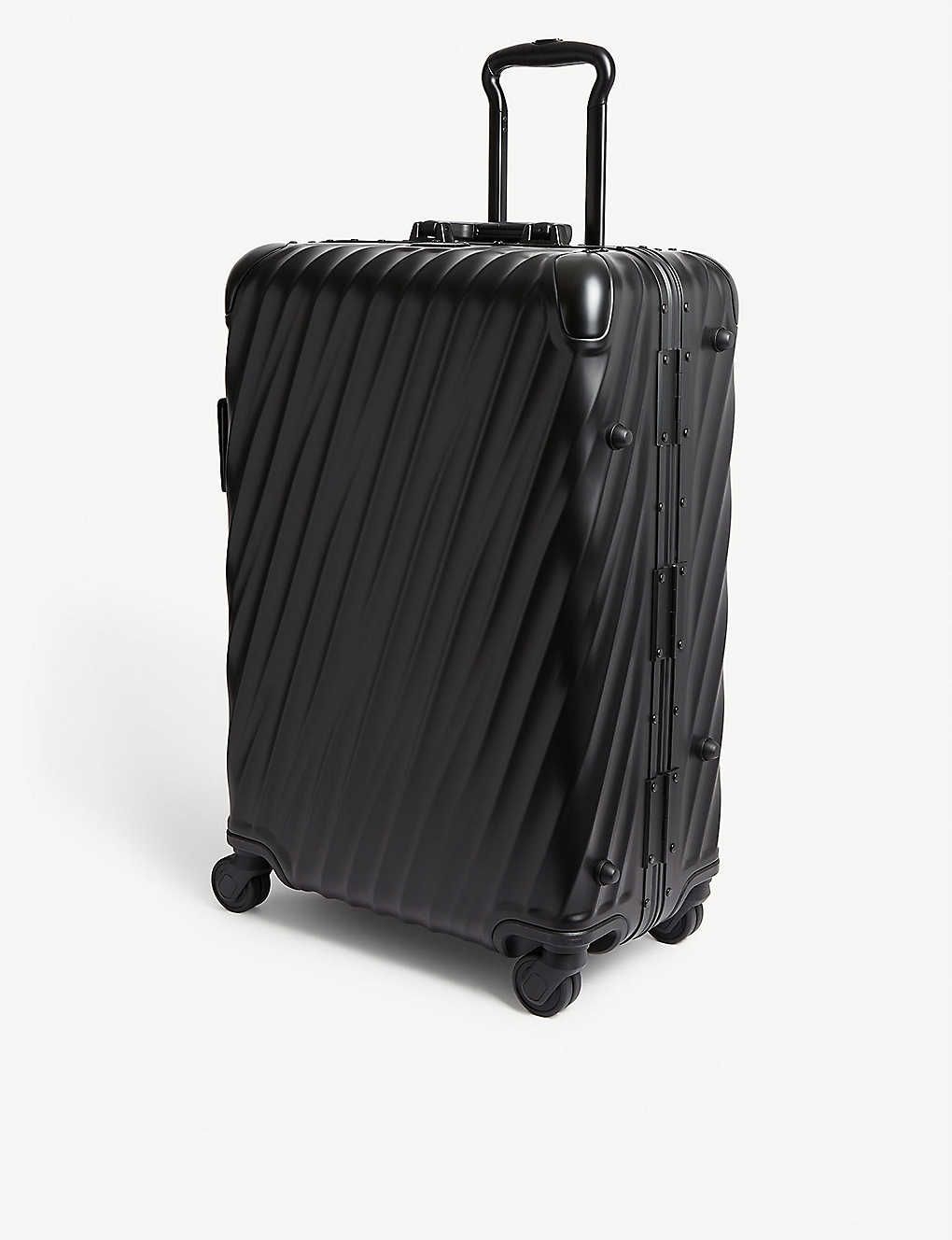 Short Trip 19 Degree packing four-wheel suitcase 68cm | Selfridges