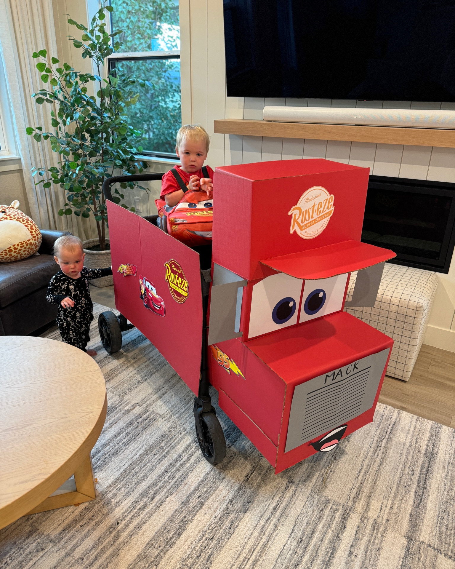 Here is everything we used for this Cars themed family costume! The wagon is just made of tri-fold poster board, cut out paper, lots of tape, and a few zip ties!