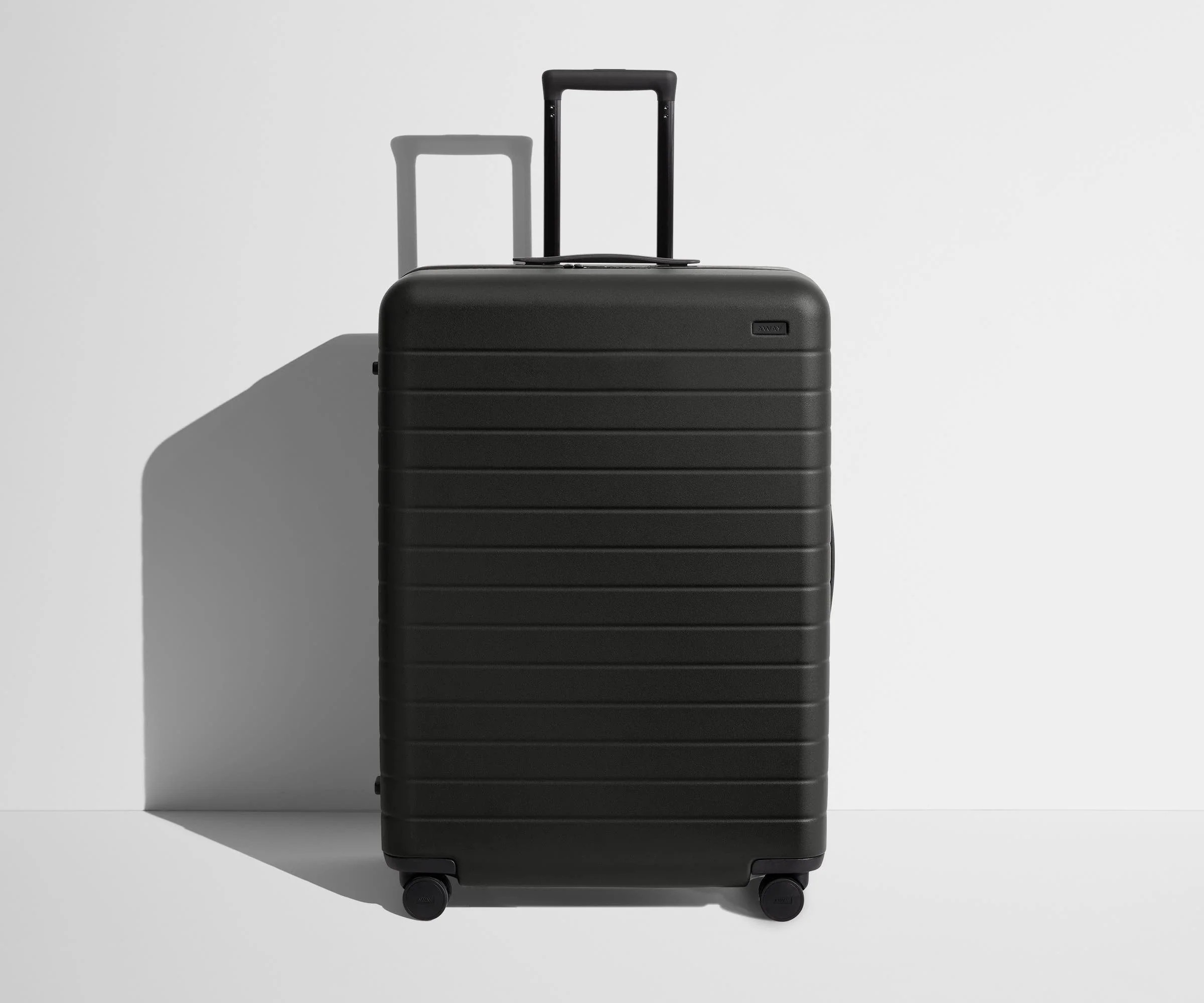Shop Large & Checked Suitcases in Jet Black | Away | Away