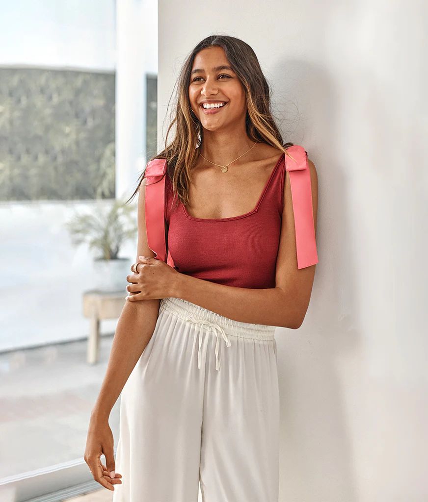 Who says basics can't make a statement? Soft and body-skimming, this knit tank flaunts cotton pop... | SummerSalt