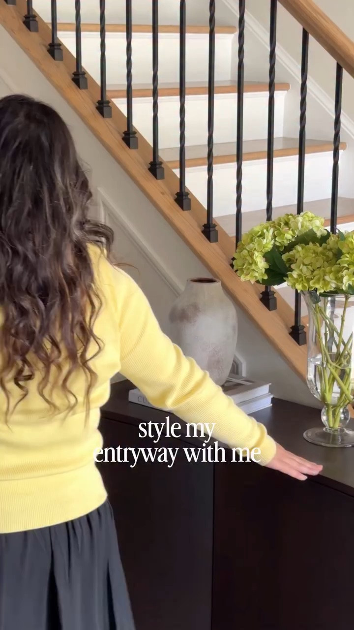 The entryway sets the tone for your entire home! For all the links, comment “ENTRYWAY” and I’ll DM you! 💌

I paired two storage cabinets together—not only because they’re beautiful, but because they help hide the everyday clutter! A lamp adds warmth and a soft glow, while a few simple accents keep the space feeling welcoming and intentional.

Functional, beautiful, and the perfect first impression! 

#entryway #entrywaydecor #sideboardstyling #interiordesign #wayfairpicks

Warm entryway remodel | dark oak sideboard | spring home decor | entryway decor inspiration