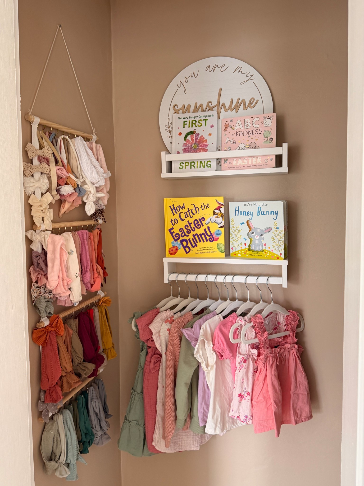 Creating a simple toddler organization system for spring outfits and seasonal books has been a total game changer in our home. Having this small space dedicated to toddler outfits, toddler girl clothing, and April picture books makes getting dressed easier and helps me actually rotate through all of our seasonal outfits before they’re outgrown.

I love how this doubles as functional nursery decor and spring decor while keeping everything accessible for everyday use. If you’re looking for practical toddler clothing organization ideas, playroom organization, or ways to style a baby room / toddler space—this is such an easy setup to recreate.

Perfect for moms wanting a mix of toddler fashion, seasonal decor, and realistic organization that actually works day-to-day.

#LTKBump #LTKHome #LTKBaby #LTKKids #LTKmomlife