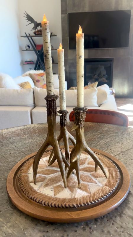 Mountain living or Texas style. WhTever your style. These battery operated birch candlestick holders are so real like. Look and to the touch feels like wax without the mess or chance of catching something Lon fire. Use cowhide placements on top of a lazy Susan for a beautiful center piece. 
#mointainliving #homedecor #homedecor #homeonteriors #antlercandlestickholder #cowhideplacemats #lazysusan 

#LTKhome #LTKfindsunder50 #LTKfindsunder100