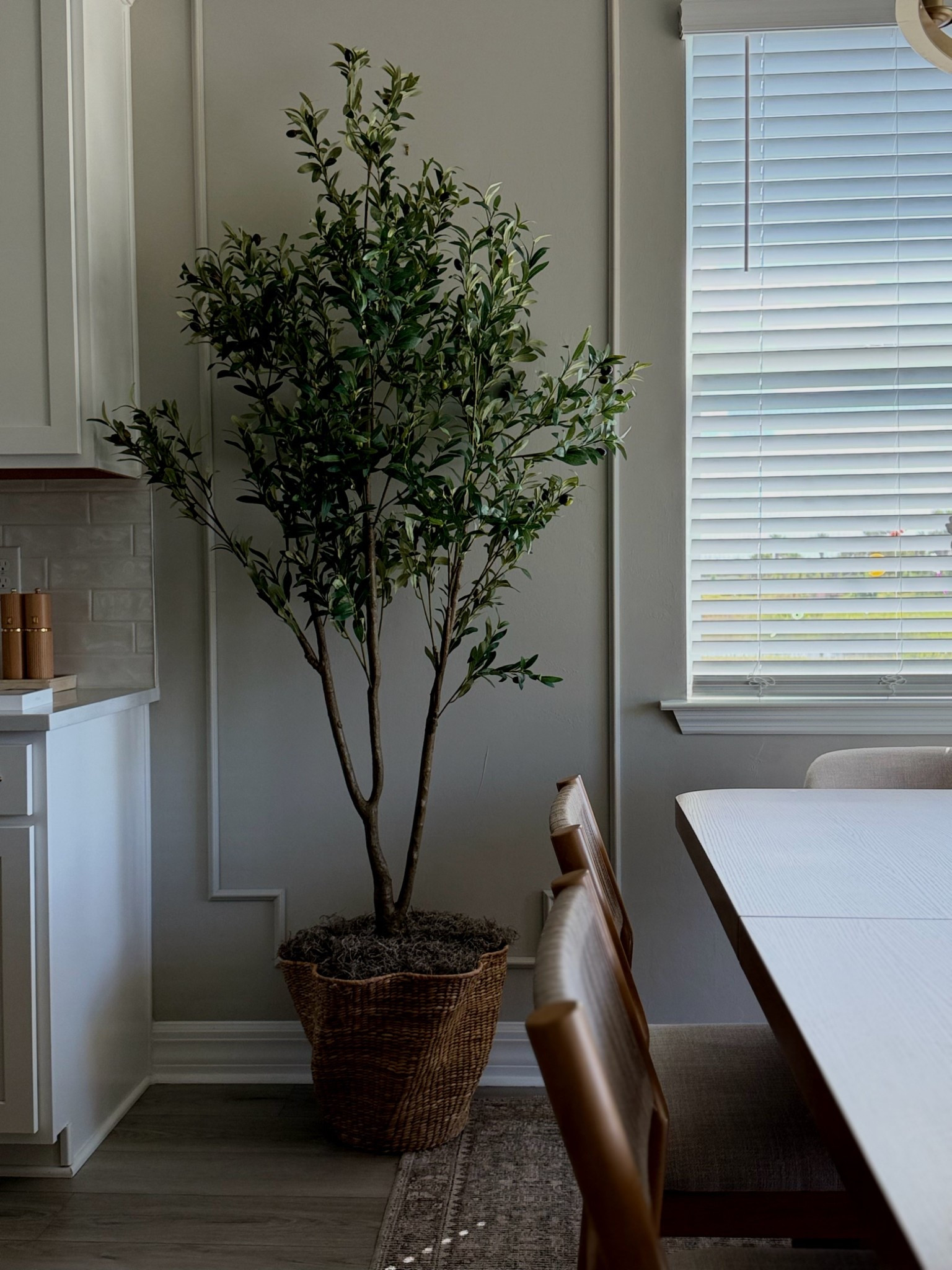 To get this look I added a few books in the scalloped basket and placed the faux olive tree in it. Then added newspaper to fill the gaps. Topped it up with Spanish moss 

#LTKStyleTip #LTKHome