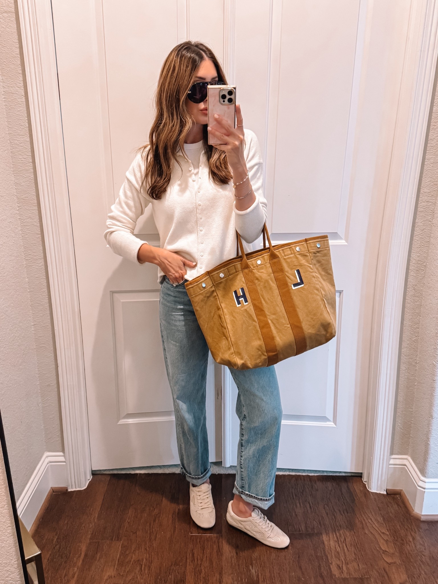 Small in tank, medium in cardigan, 26 in jeans (baggy on me) 