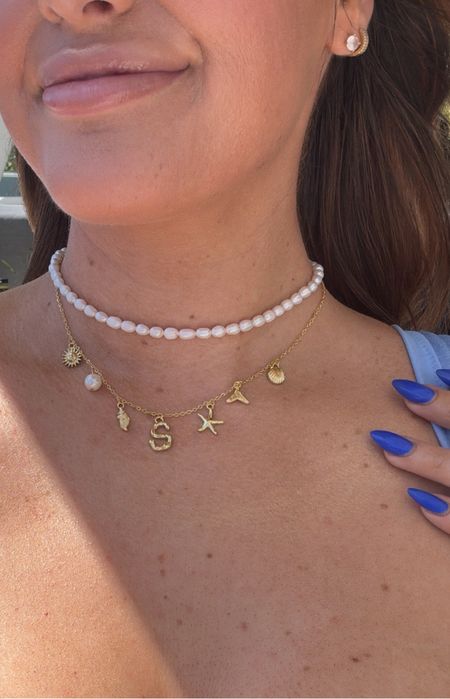 I layered this cute charm necklace & pearl necklace with my swim outfit for the beach and boat today! 💅🏻🌊🥂 love that you can customize it to your own letter :)

#LTKtravel #LTKswim #LTKstyletip