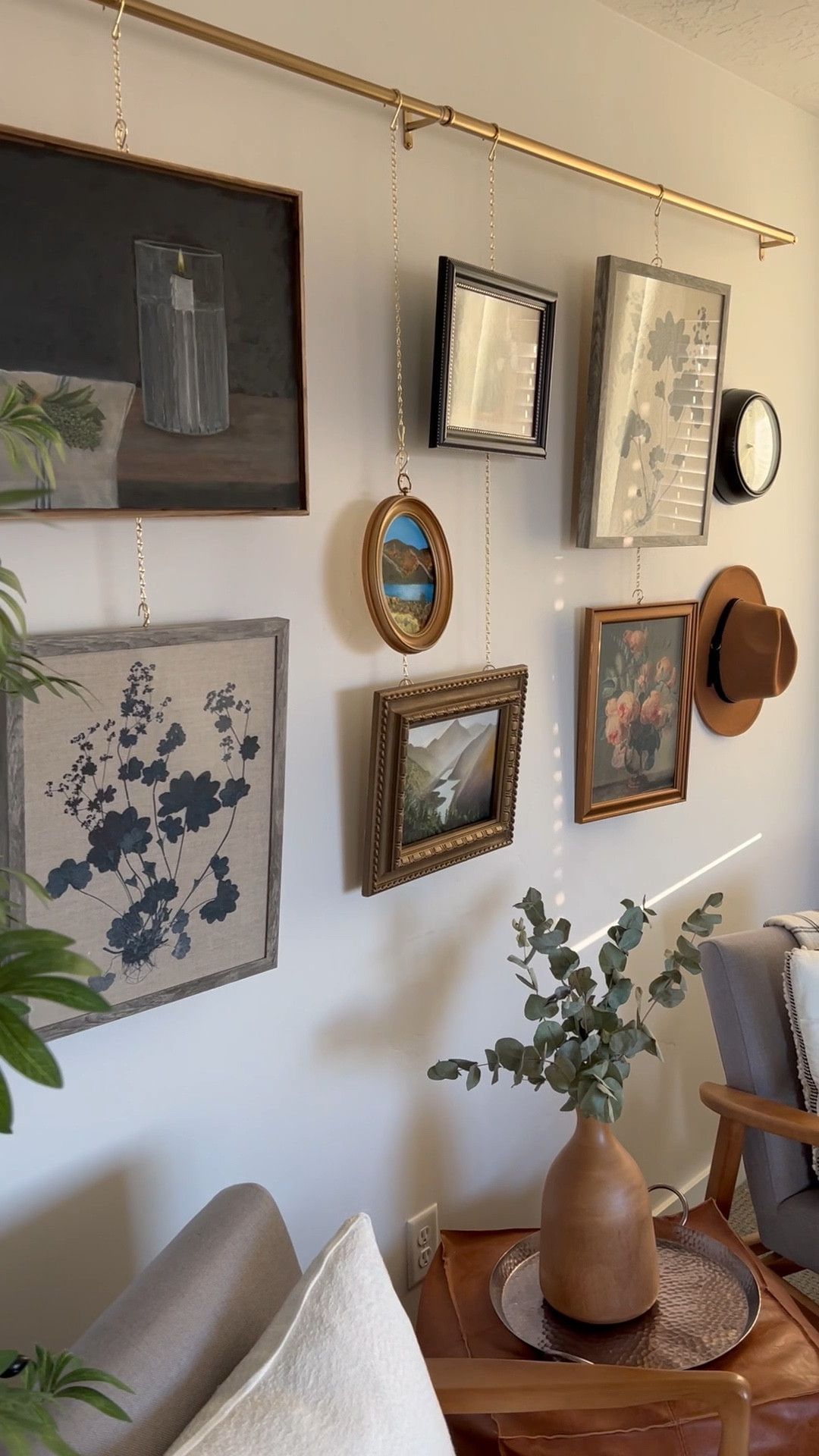 A picture rail is a great unique take on a gallery wall. We DIY-ed one with a curtain rod and some hanging planter basket chains.

Accent chairs, paintings, prints, felt hat, retro clock, leather pouf, cable knit throw pillow, oval frame, vintage style, framed fabric prints, floral art, still life, landscape

#LTKeurope #LTKunder50 #LTKhome