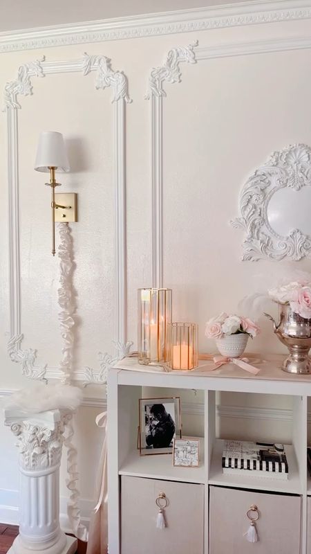 A little living room decor 🤍🤍 

Gold sconce / pink floral arrangement /tassels / horse statue / console table / Serena and Lily / silk cord cover / fur decor / statue / french decor /Parisian decor / pink and white decor / french aesthetic 

#LTKstyletip #LTKhome #LTKitbag